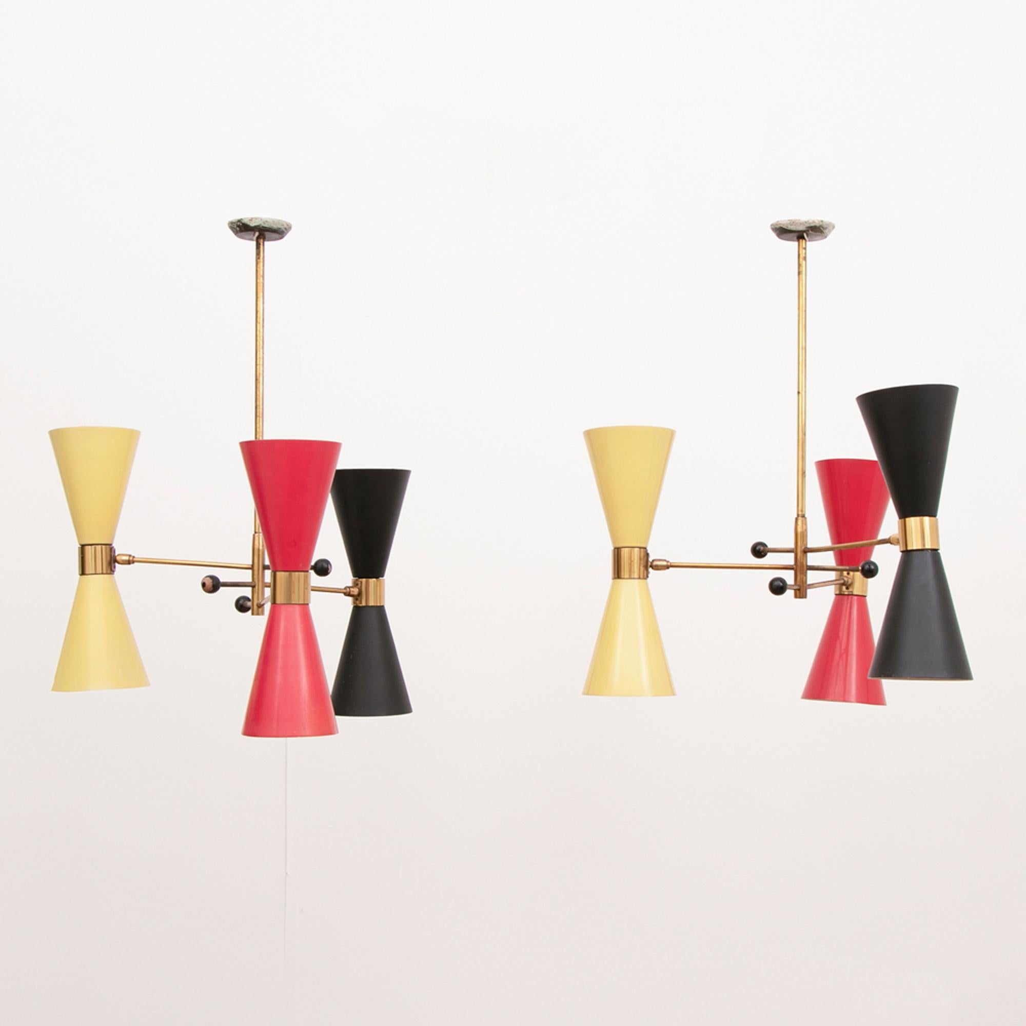 A pair of 1950s Stilnovo urchin cone lights each light with three double-ended cone shades in yellow, black and red. Fully rewired.