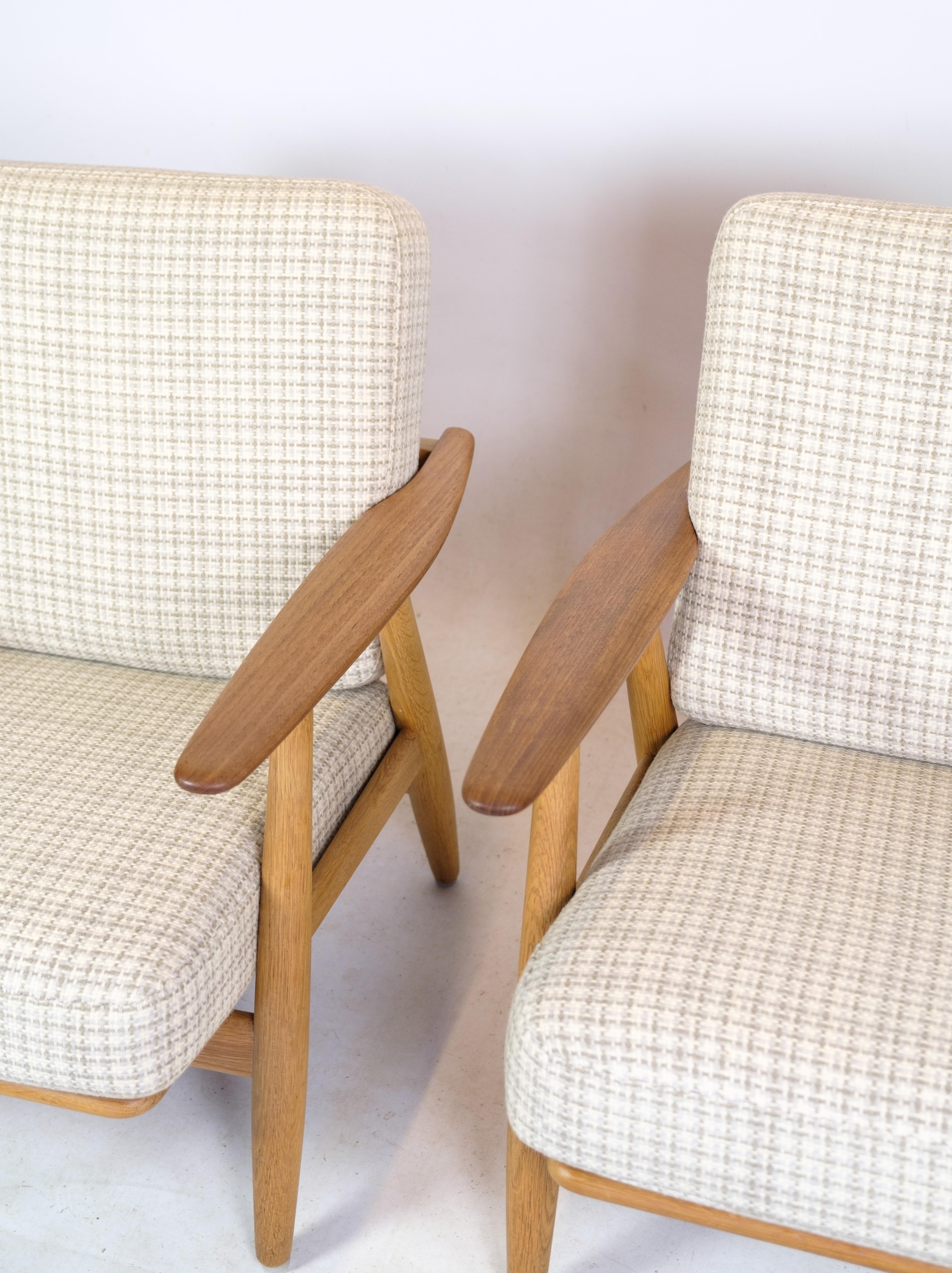 Hans J. Wegner

Pair of GE-240 Cigar chairs, 1955

Produced by Getama in Gedsted, Denmark in the 1950s. These examples of Wegner's iconic lounge chair are made from European oak with their original sprung cushions reupholstered stribed white fabric. 
