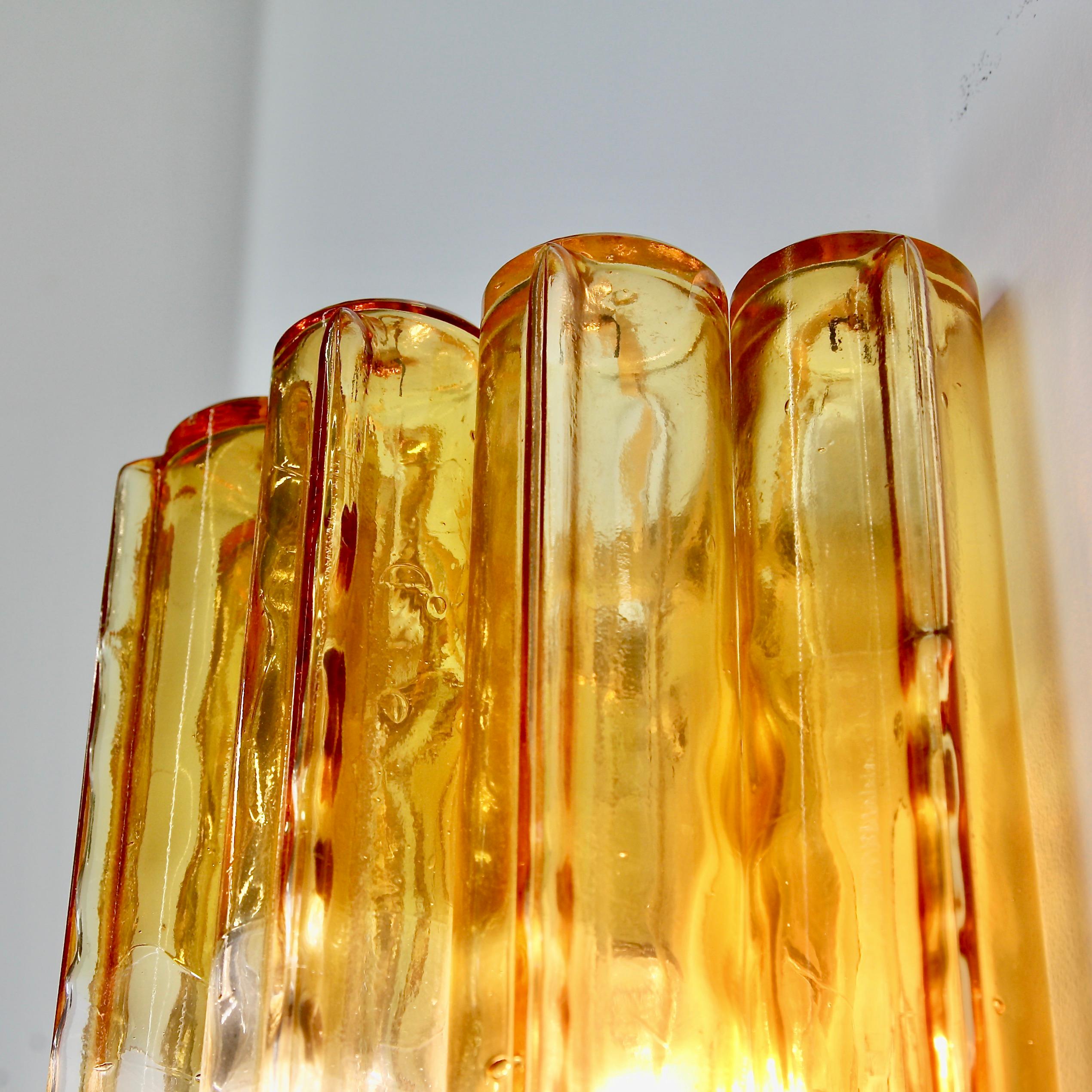 Pair of early original Venini glass wall sconces. Italy, 1960.

A pair of wall lamps with hand blown 