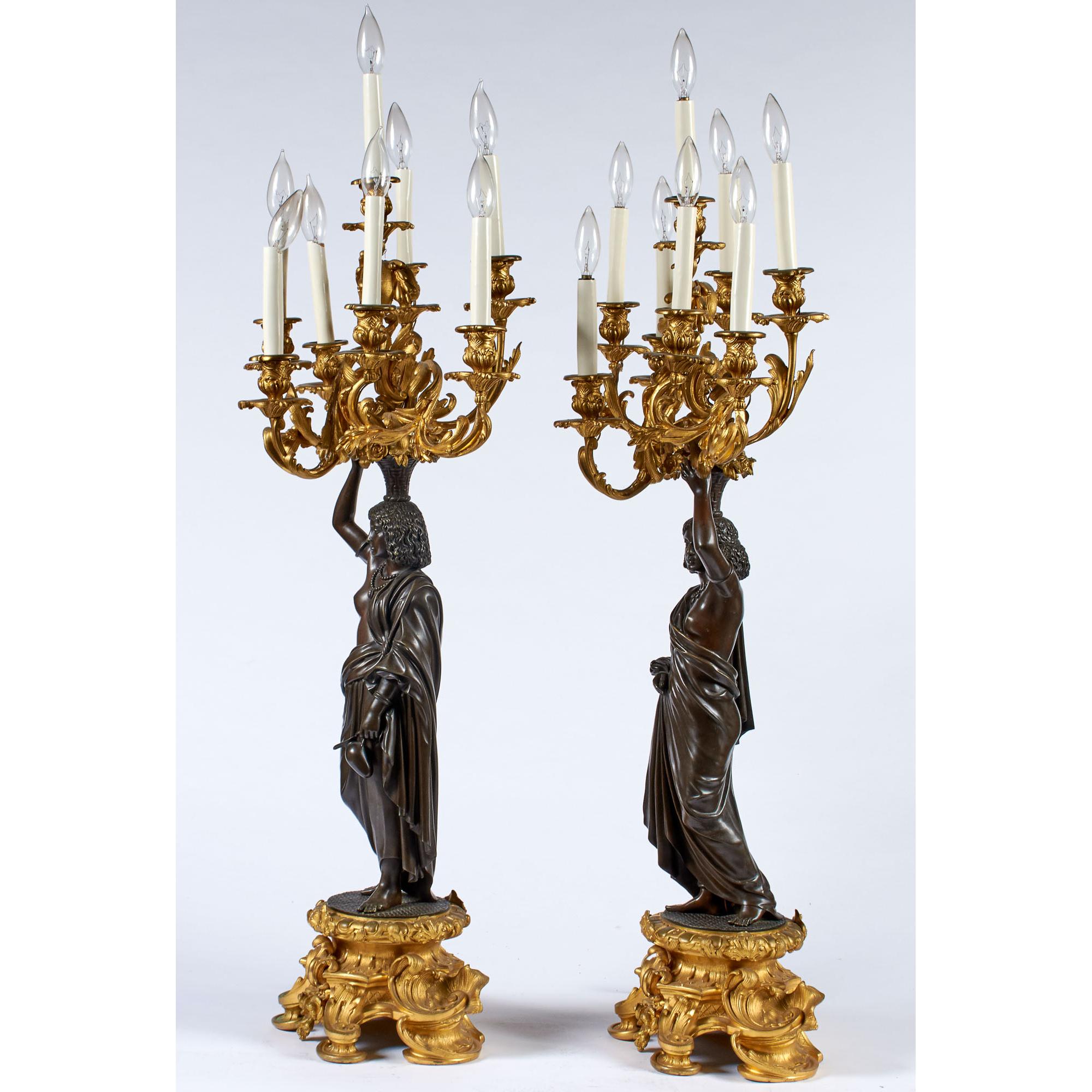 Fine Quality Pair of Ormolu and Patinated Bronze Figural Eight-Light Candelabras

Origin: French
Date: Circa 1900
Dimension: 37 1/2 inches tall