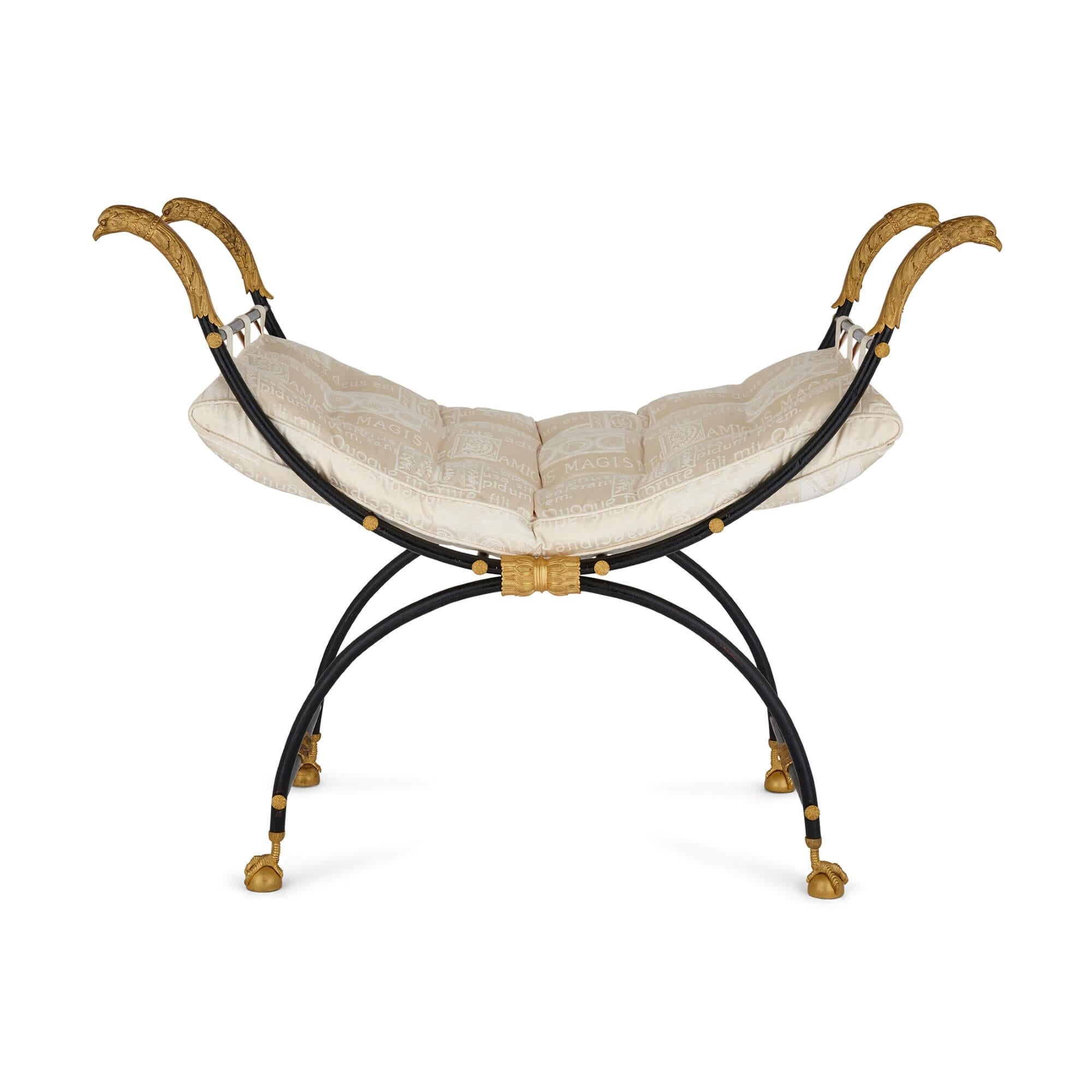 Lacquered Pair of ormolu mounted and lacquered metal curule chairs in the Empire style For Sale