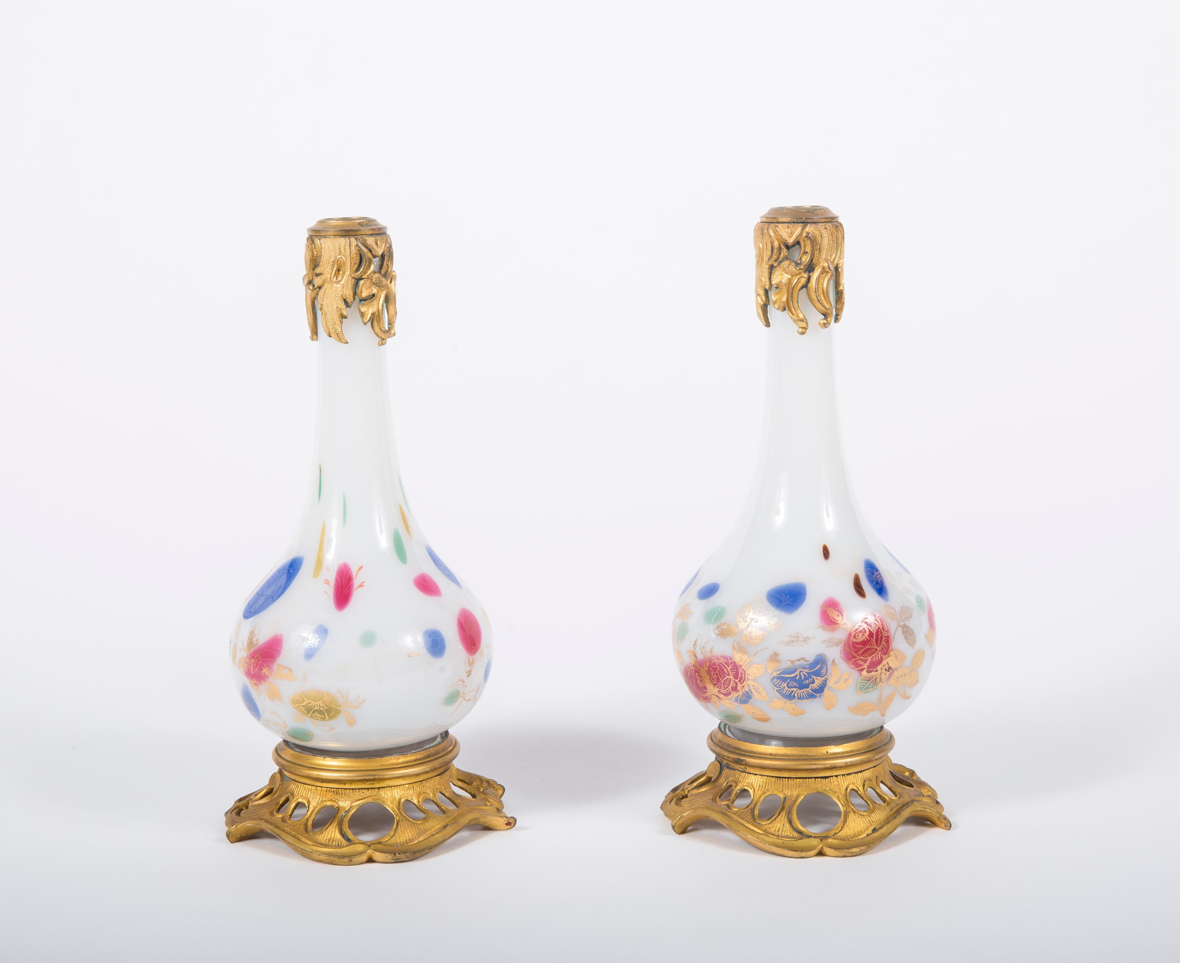 A pair of white opaline bottles, painted with gilt bronze mounts. Flame tip mounted caps, 19th century.
Measures: H 9 in (22.8 cm)

Inv No. NMA 3454.
