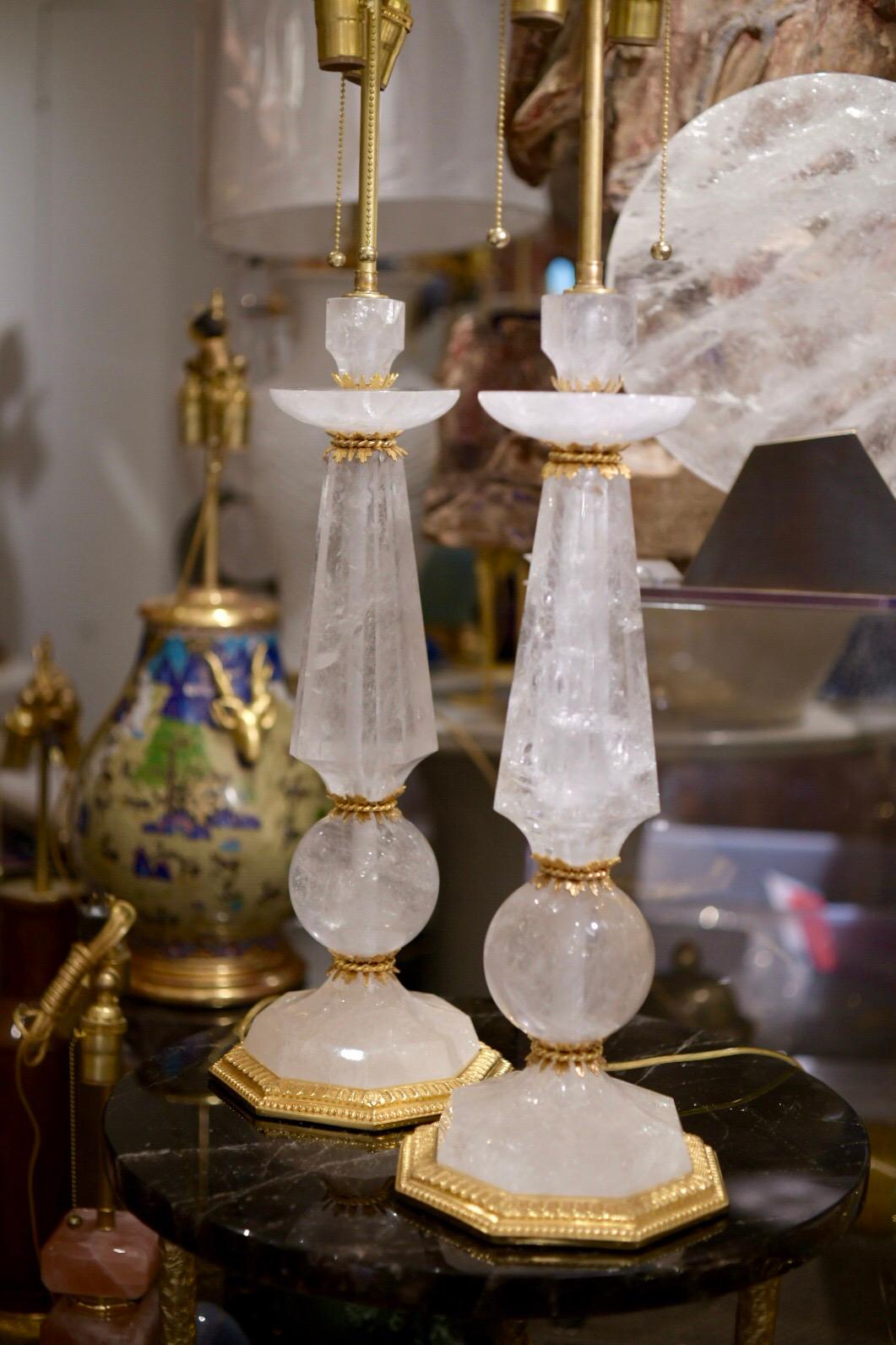 Pair of fine carved prism and globe rock crystal lamps with polish brass decorations and base.
Custom quantities available.
Measures: To the rock crystal: 22 in/H
(Lampshade not included).
