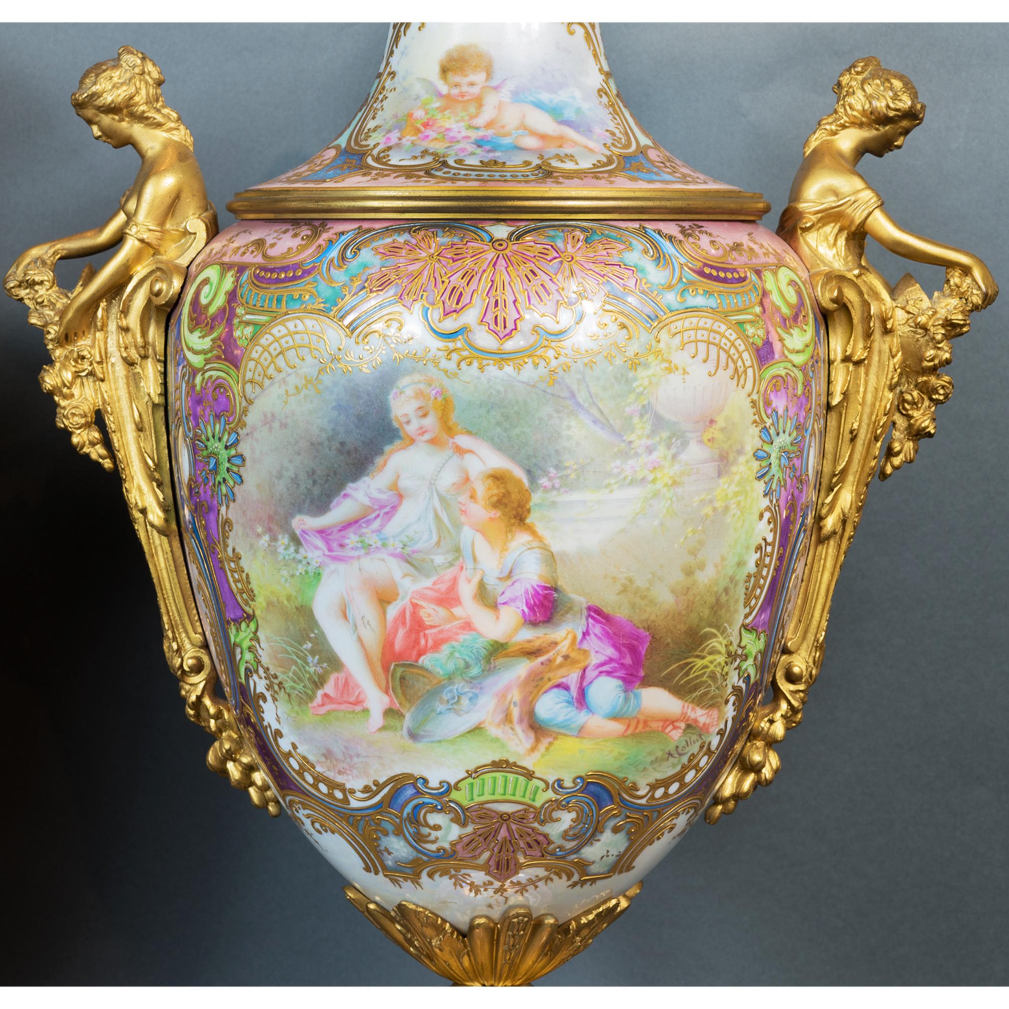 Pair of ormolu-mounted sevres style porcelain iridescent-polychrome vases and covers with two female figures relaxing in a lush garden, each vase depicting a different moment in the garden. Gilt bronze ornamentation and bases with foliage and