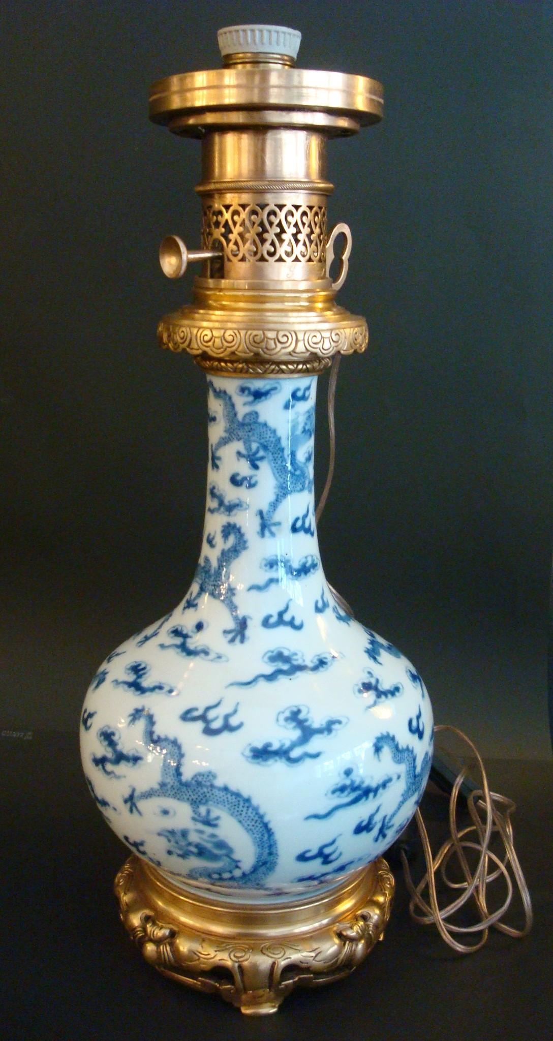 Pair of ormolu-mounted attr. Theodore Deck Chinese white and blue Dragons vases mounted as table lamps 19th century.
Each in the Chinese taste. The base of the fitment with plaque 'Gagneau 115 Rue Lafayette'
These beautiful table lamps have been