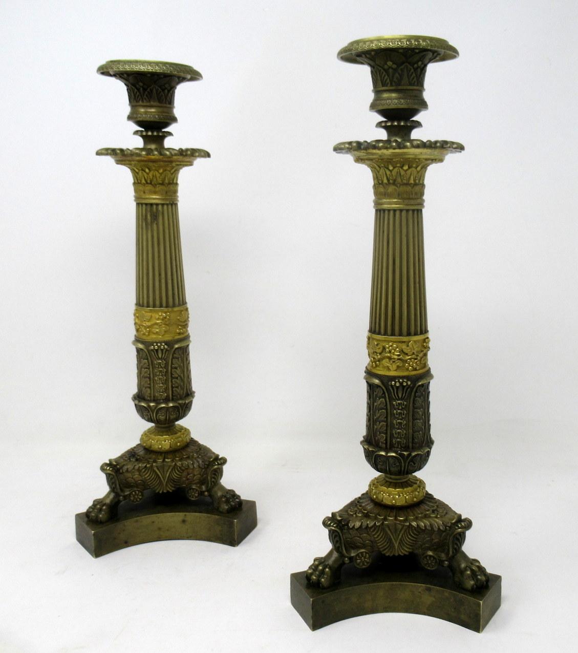 Stunning pair of French heavy Gauge Ormolu and patinated bronze single light candlesticks of exhibition quality and of generous tall proportions. 

Each having a Campana-form leaf cast candle socket with original firm fitting removable foliate