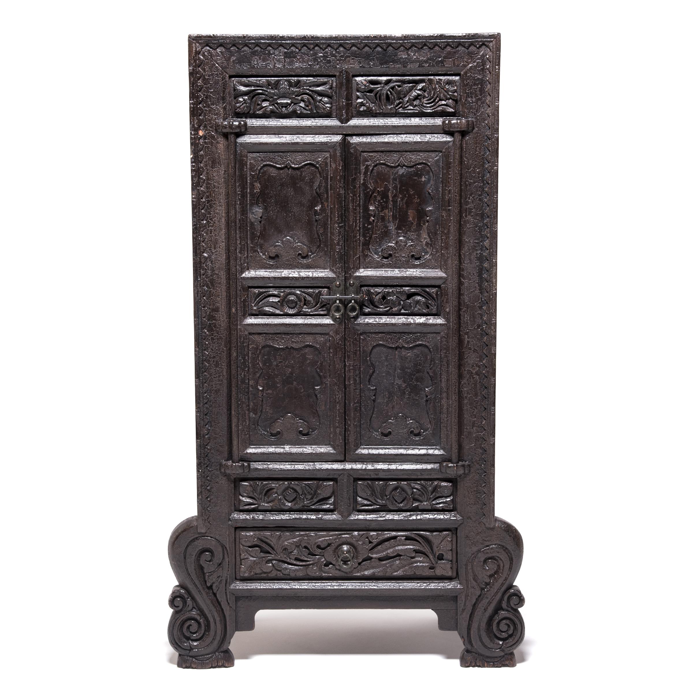 These richly carved and lacquered cabinets were made over 150 year ago in China’s Shanxi Province and remain in remarkable condition. The cabinet fronts are well-proportioned and carved with imaginative detail, including a scalloped trim, swirling