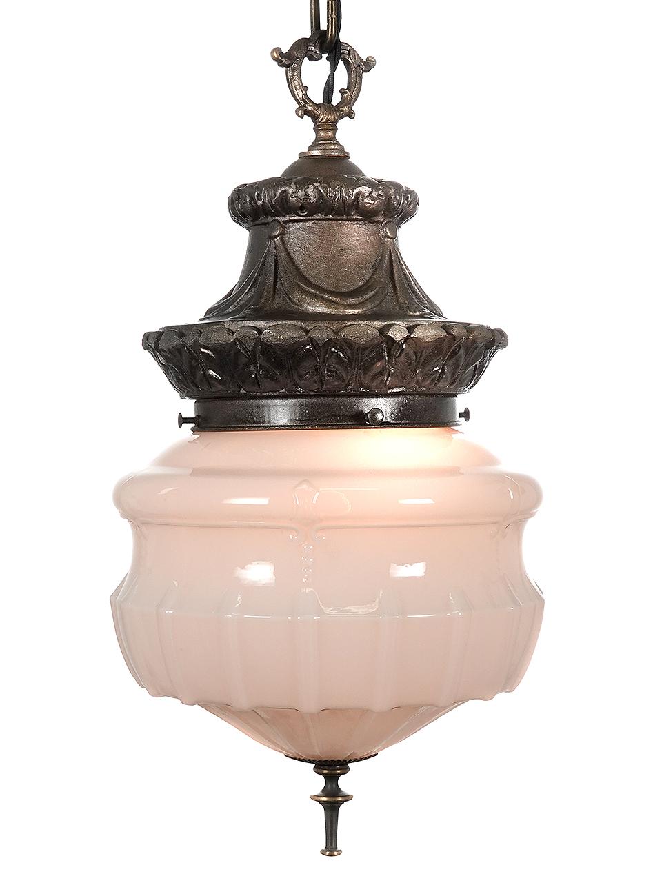 This is a nice matching pair of decorative pendents. The plaster shade holder has an organic form and creates an interesting crown. The bottom has a long turned brass detail. The milk glass shade it self has an impressive 10 inch diameter an is