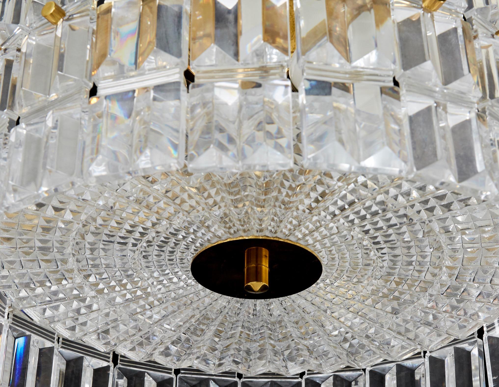 Pair of crystal Orrefors semi flushmount from the 1970s by Carl Fagerlund,
A brass frame with a bottom press crystal plate held by a high polished round flat brass disc in the middle surrounded by individual shiny crystal elements held by brass