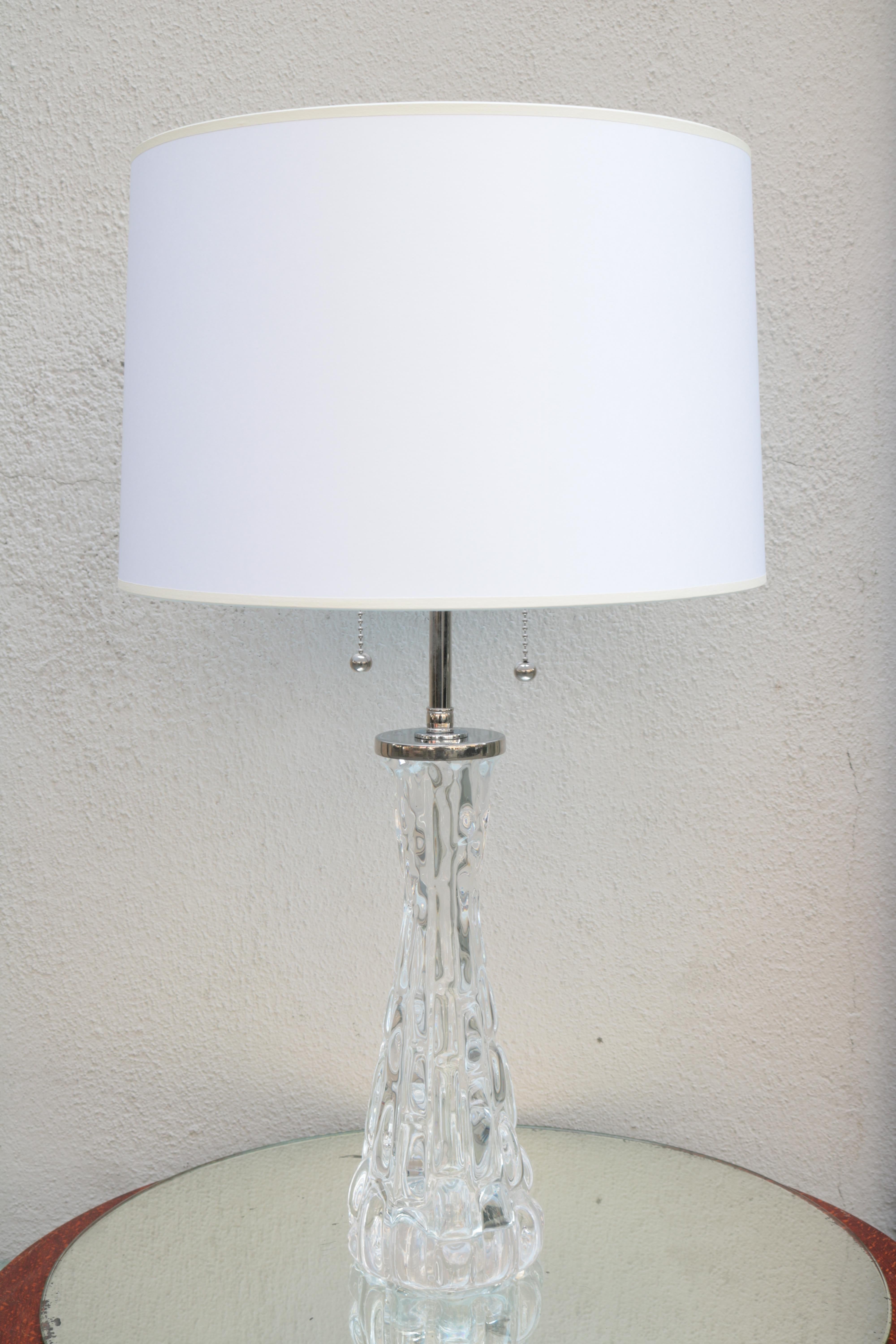 A pair of Orrefors Modernist crystal table lamps with Orrefors Signature. 
Crystal and polished nickel.