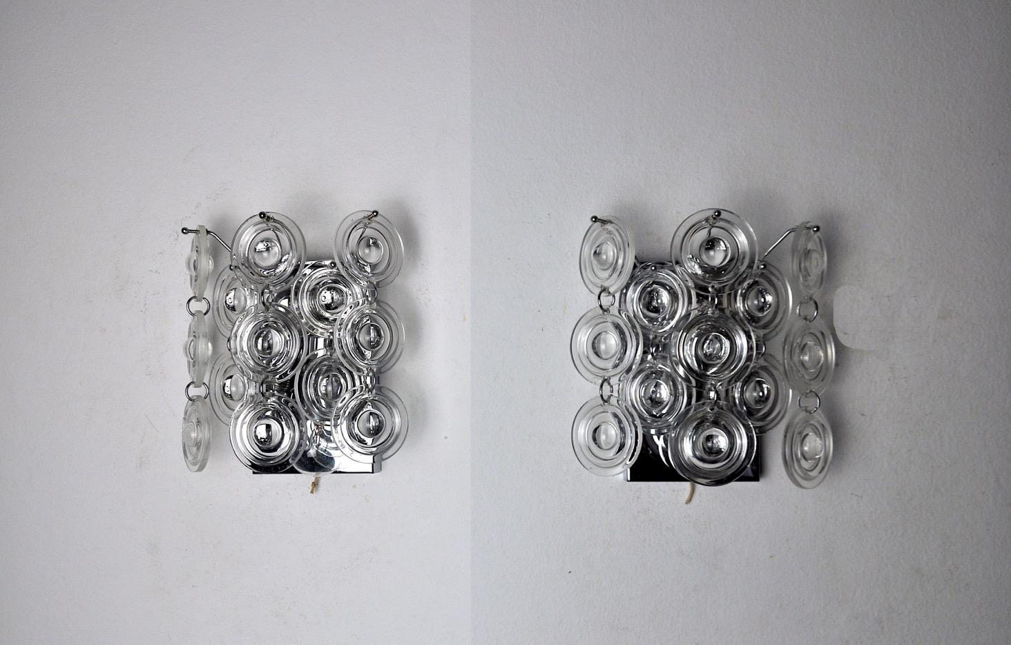 Very nice pair of oscar torlasco wall lights produced in italy in the 70s. Murano glass and chromed metal structure. Unique object that will illuminate wonderfully and bring a real design touch to your interior. Electricity checked, mark of time in