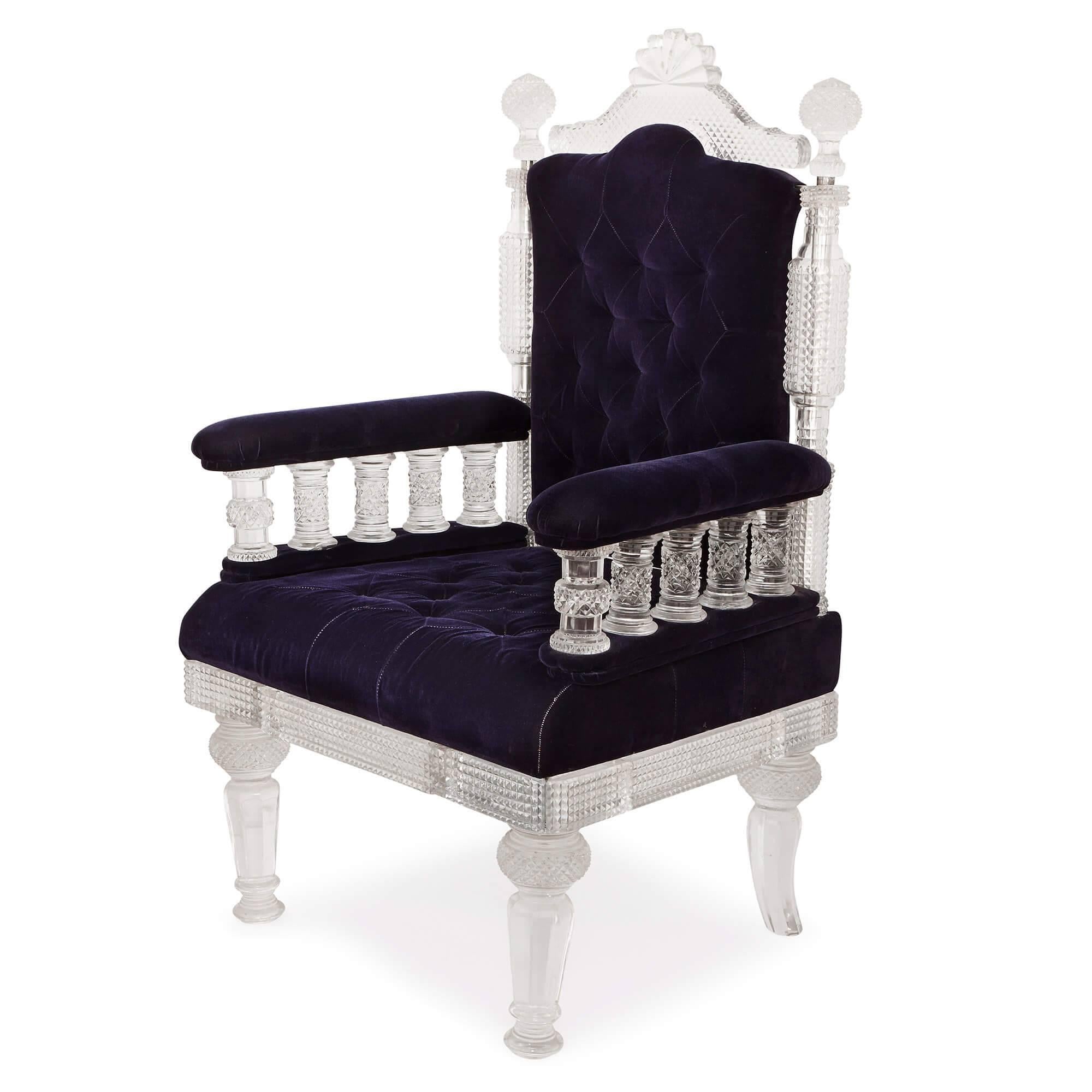 This stunning pair of armchairs are luxury pieces par excellence: built from exquisitely-textured cut glass and upholstered in rich purple velvet, they have been designed with comfort as well as style in mind. The unusual design of these chairs is