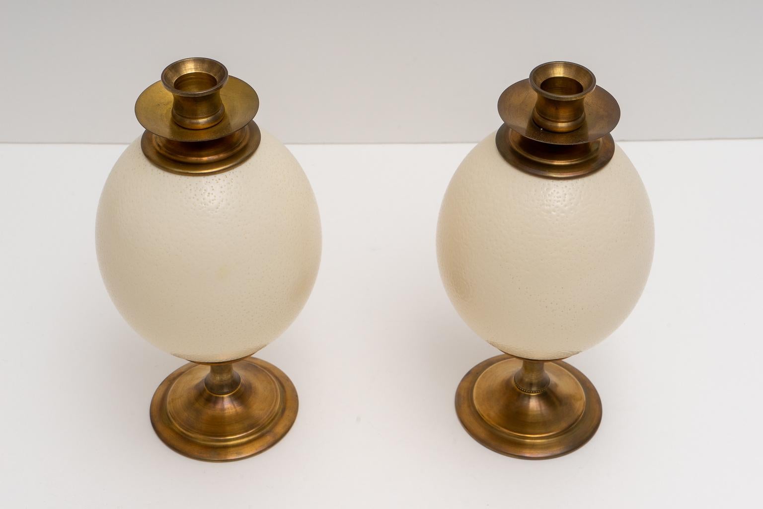 This stylish set of ostrich eggs mounted as candle sticks were acquired from a Palm Beach estate and are very much in style of pieces created and coveted by Tony Duquette.