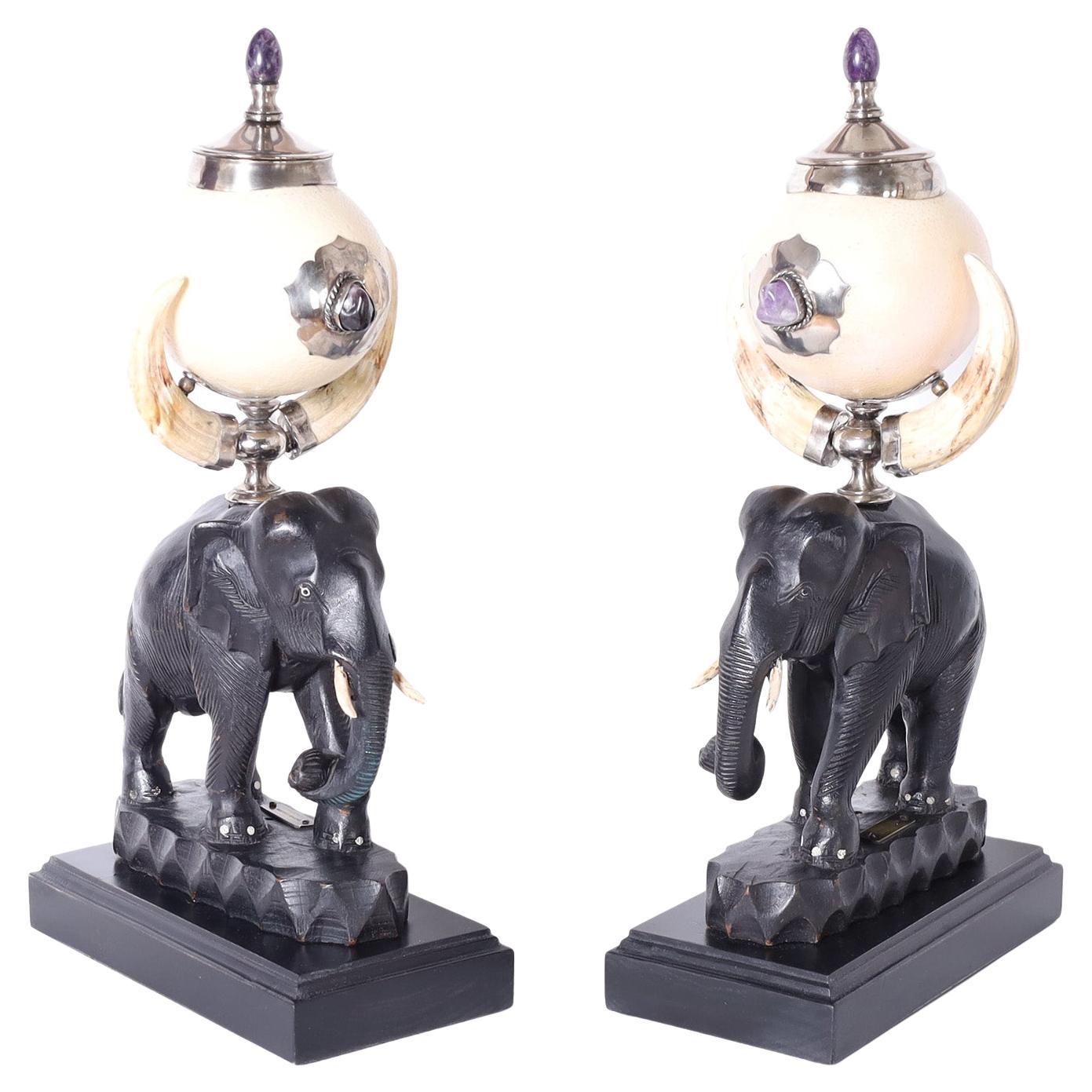 Pair of Ostrich Egg Urns on Carved Elephants For Sale