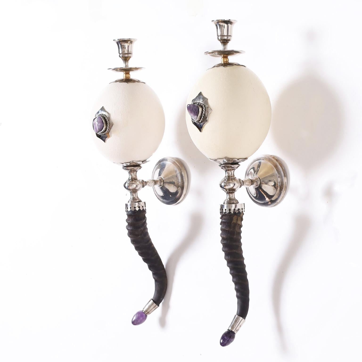 Impressive pair of vintage wall sconces with an eccentric mix of materials featuring ostrich eggs decorated with amethyst stones, antelope horns, and amethyst stone finials. Signed Redmile London.