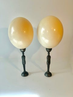 Pair of Ostrich Eggs on Male and Female Modernist Metal Figures