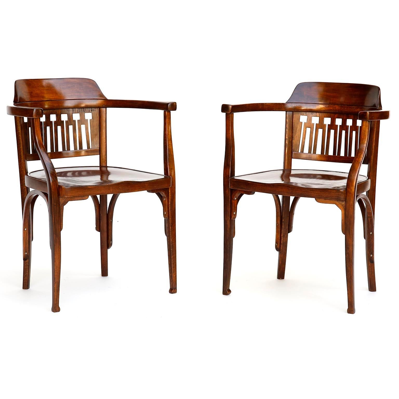 A pair of Vienna Secession bentwood armchairs by Otto Wagner and manufactured by Jacob & Josef Kohn (J. & J. Kohn), Austria, circa 1900.

The chairs are in great restored and refurbished condition. They are made of brown stained beech wood similar
