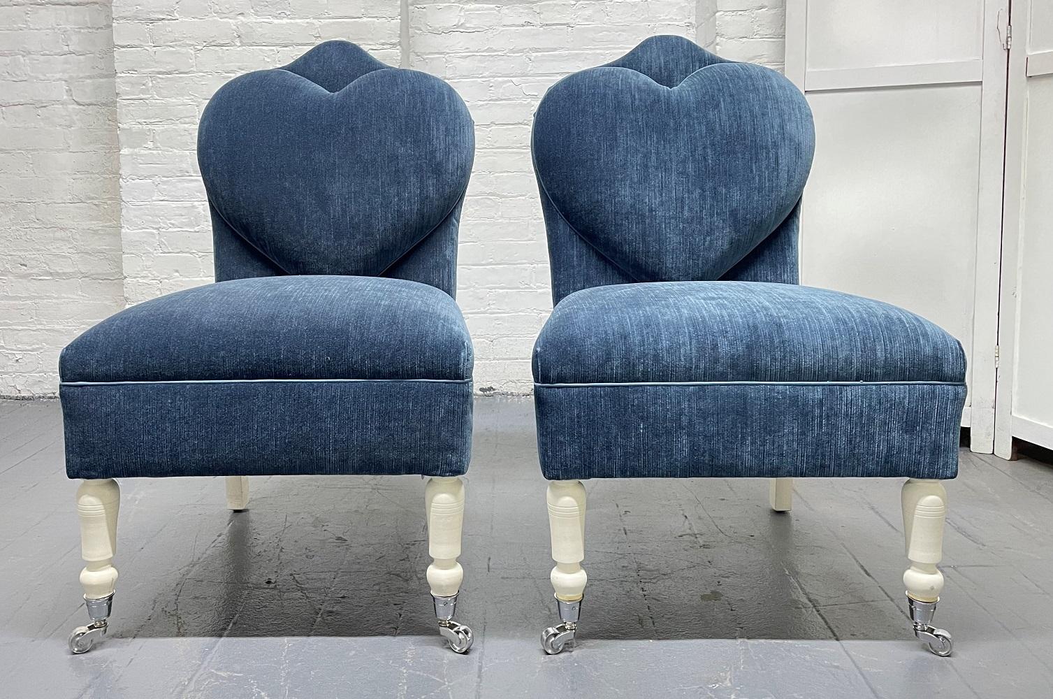 Pair of Flavor Custom Design lounge / slipper chairs. Chairs have painted wood legs, front legs have casters, and the chairs are blue velvet upholstery. Has a wonderful heart shaped back. Well designed.