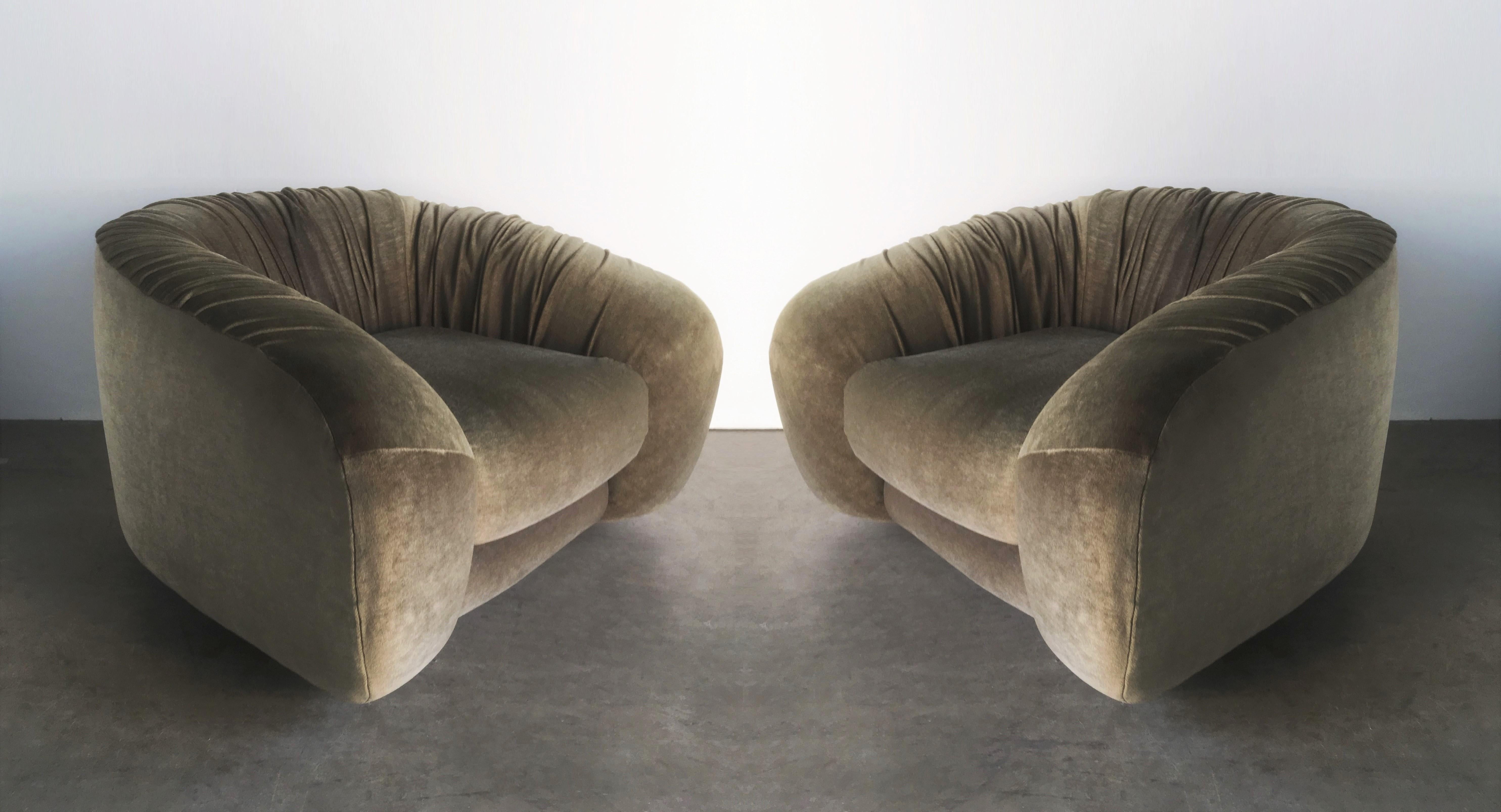 Simple and pure form! Distinguished by their originality, these elegantly rounded beasts in luxurious olive green velvet after Jean Royère. The soft round form of the Ours, which practically eliminates the typical parts and structure of most seating