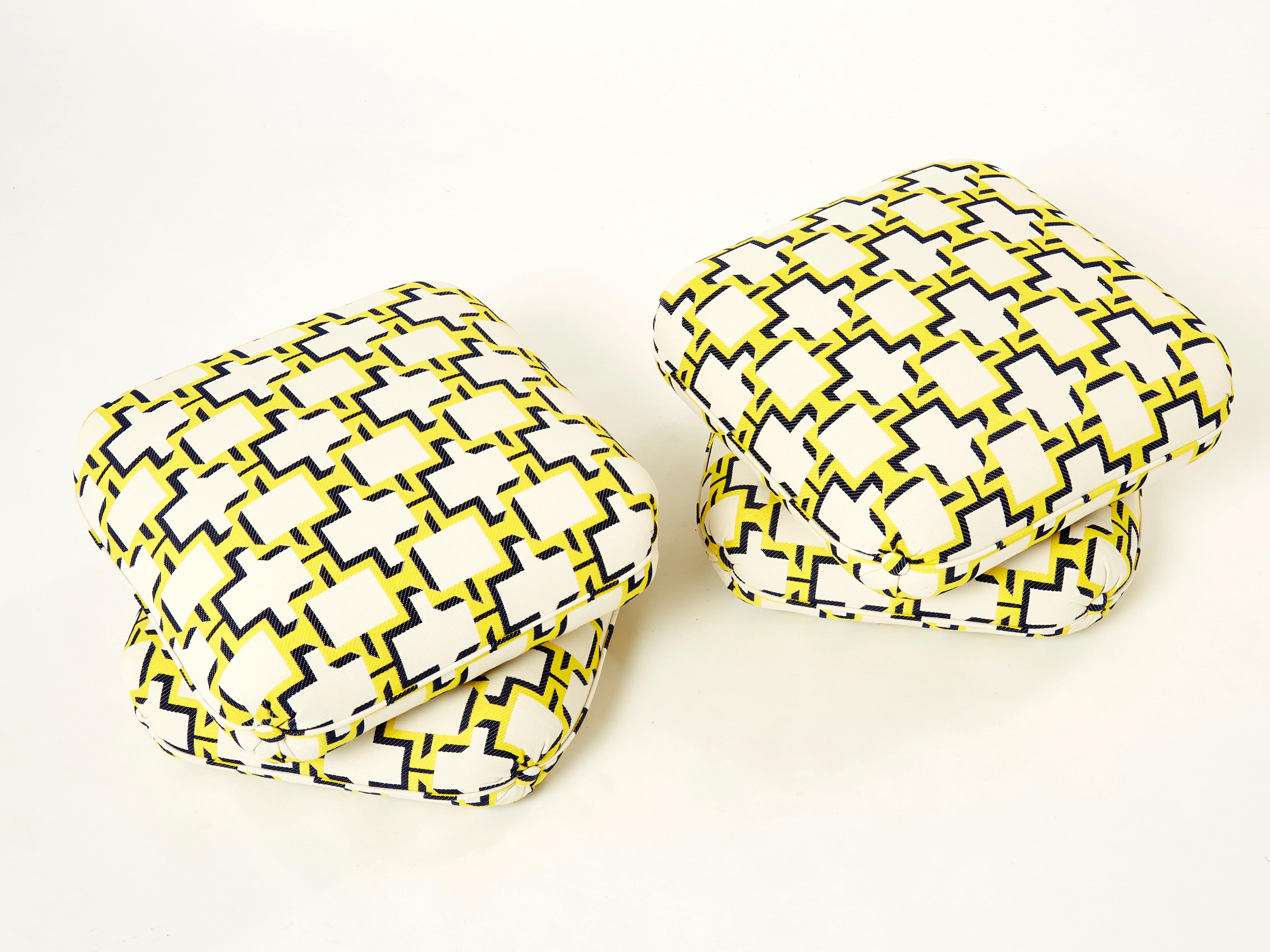 Beautiful pair of poufs or ottomans by French Designer Jacques Charpentier for Maison Jansen in the mid-seventies. The poufs consist of two large cushion elements connected together holding them in place. They have been newly upholstered in an