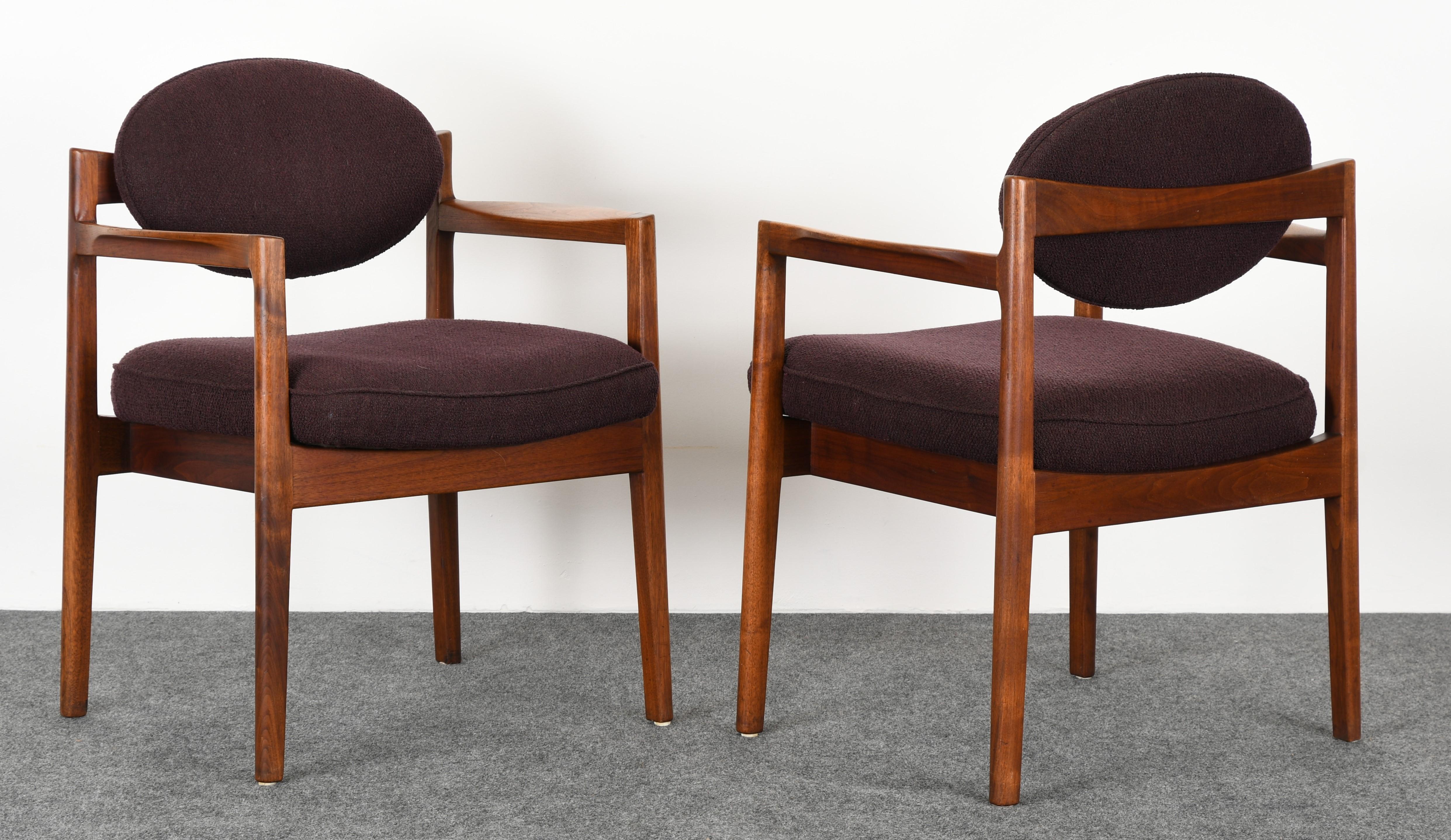 A sculptural pair of oval back armchairs by Jens Risom, 1960s. The chair frames are in good original condition, however, there are some minor imperfections on arms, as shown in images, but not distracting. These retail new through Ralph Pucci