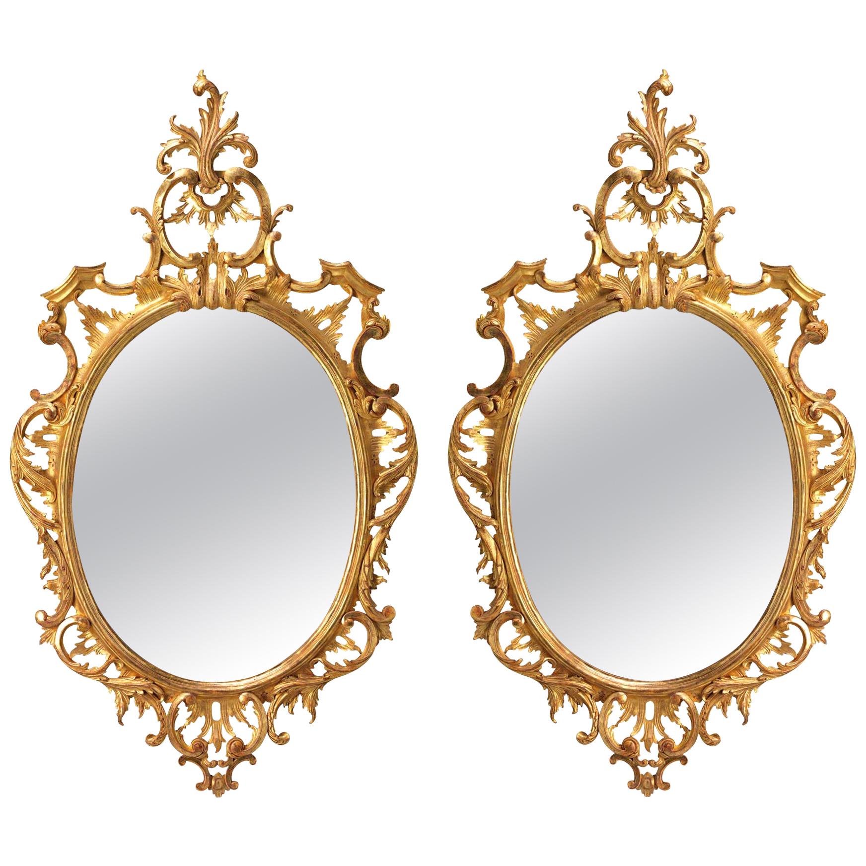 Pair of Oval Chippendale Giltwood Mirrors For Sale