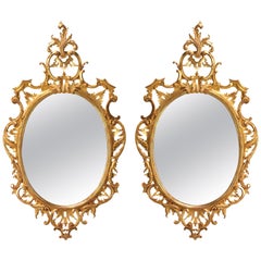 Pair of Oval Chippendale Giltwood Mirrors