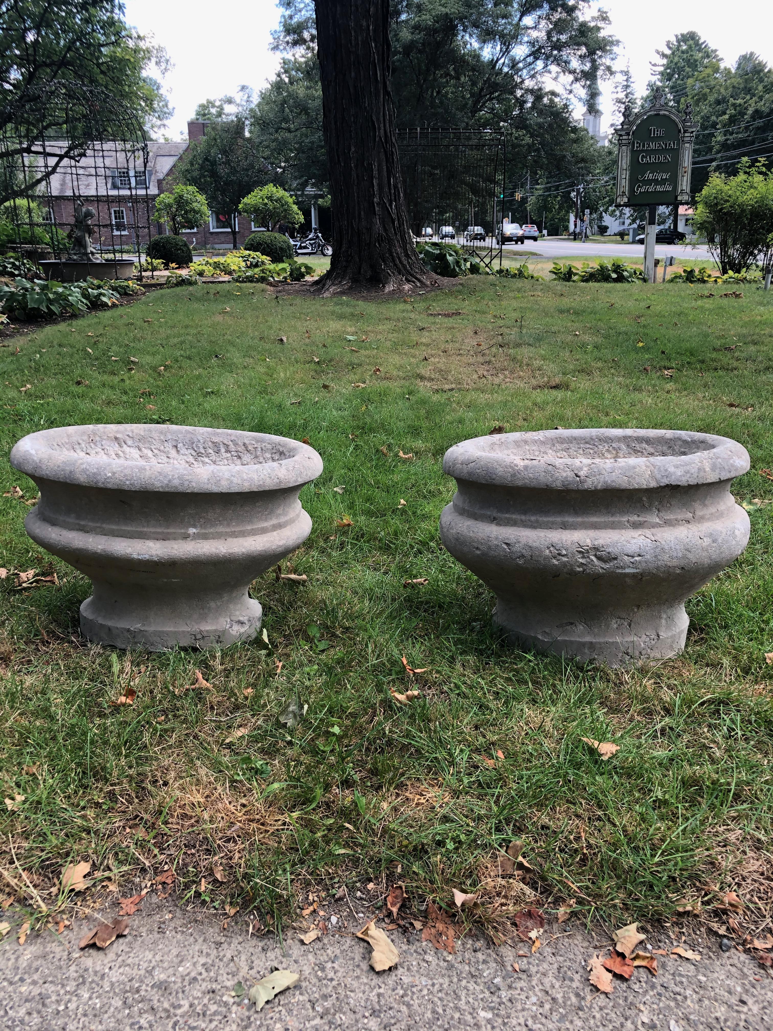 These stunning oval jardinieres on rounded feet were hand carved from single pieces of Pierre de Bourgogne (Burgundy Stone) circa 1800. In fine condition, there is one old chip to the rim of one jardiniere and a nibble to one foot shown in photos.