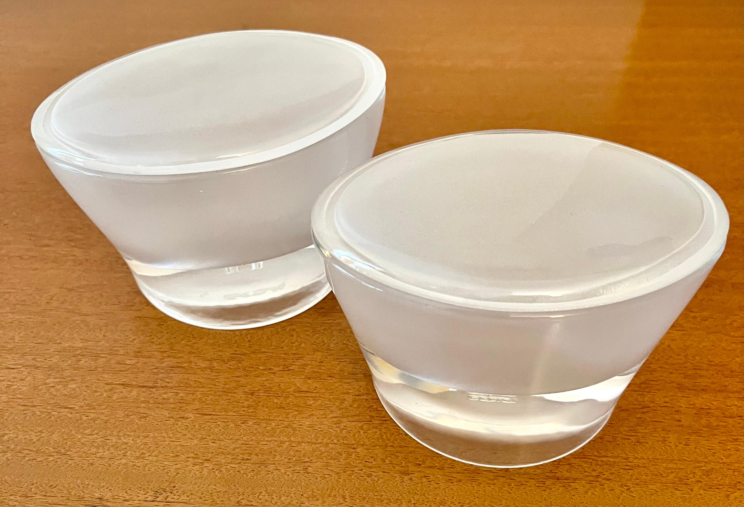 Pair of oval lidded frosted glass boxes.  The pair are unique and very versatile, for use from the vanity to your work station or desk... holding rings on your bedside or candy on your cocktail table - 

A substantial pair with a great look and a