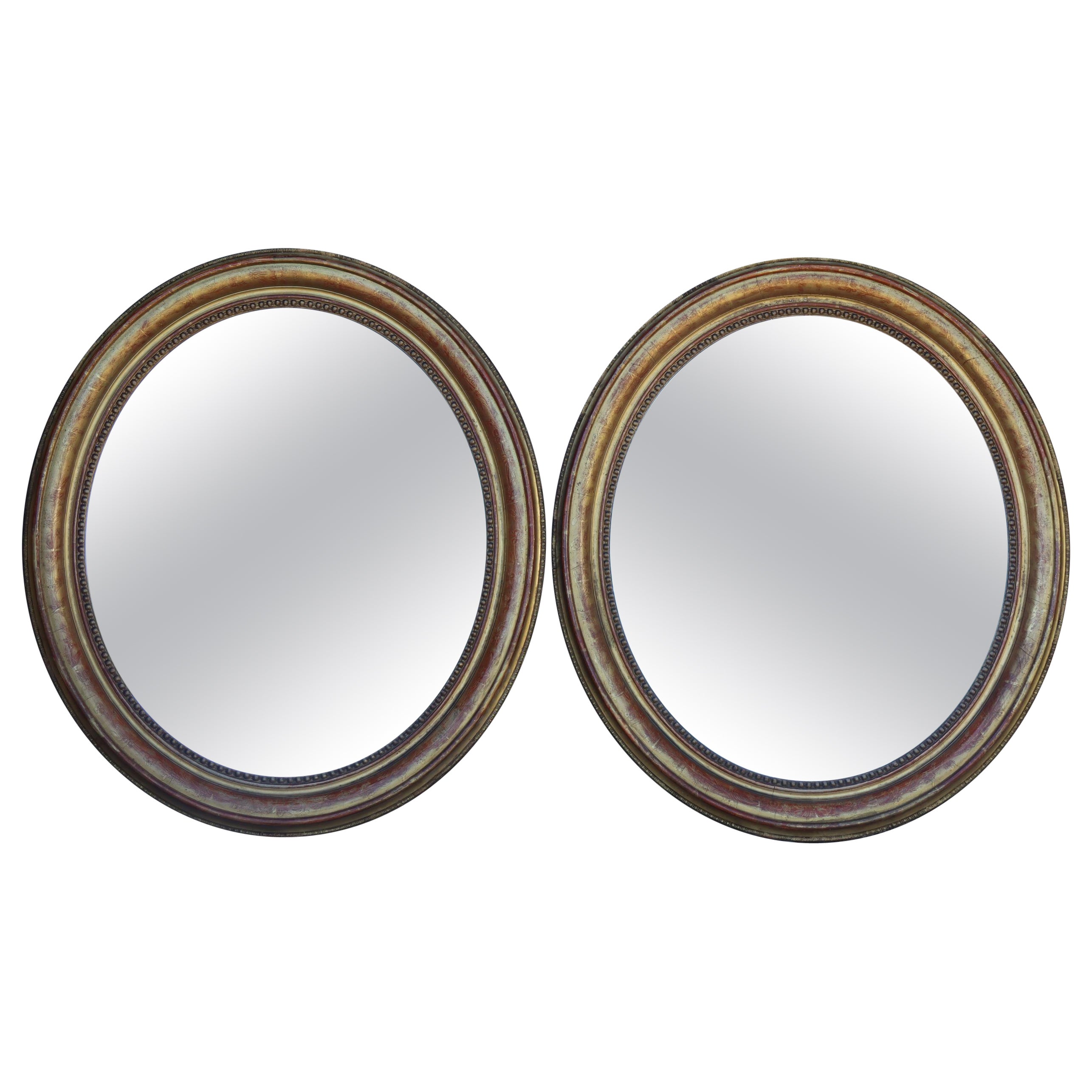 Pair Of Oval Gilded Wooden Mirrors From The Louis Philippe Period For Sale