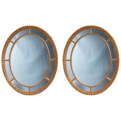 Pair of Oval Giltwood Mirrors