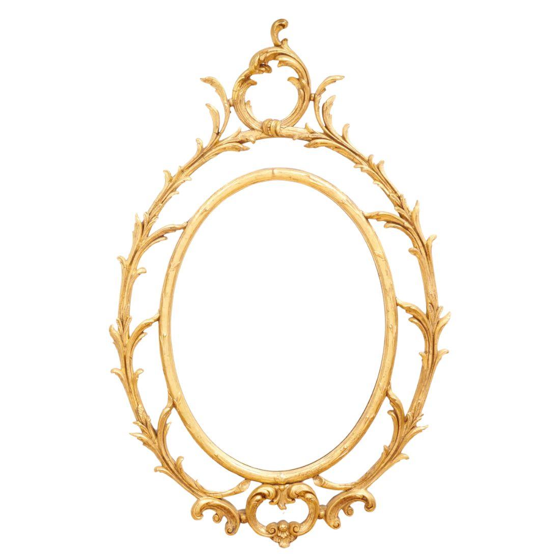 This pair of large oval mirrors features a stunning gilt frame, exuding an air of elegance and sophistication. The George III style frames are adorned with intricate scroll and leaf details, which add a touch of ornate beauty. At both the top and