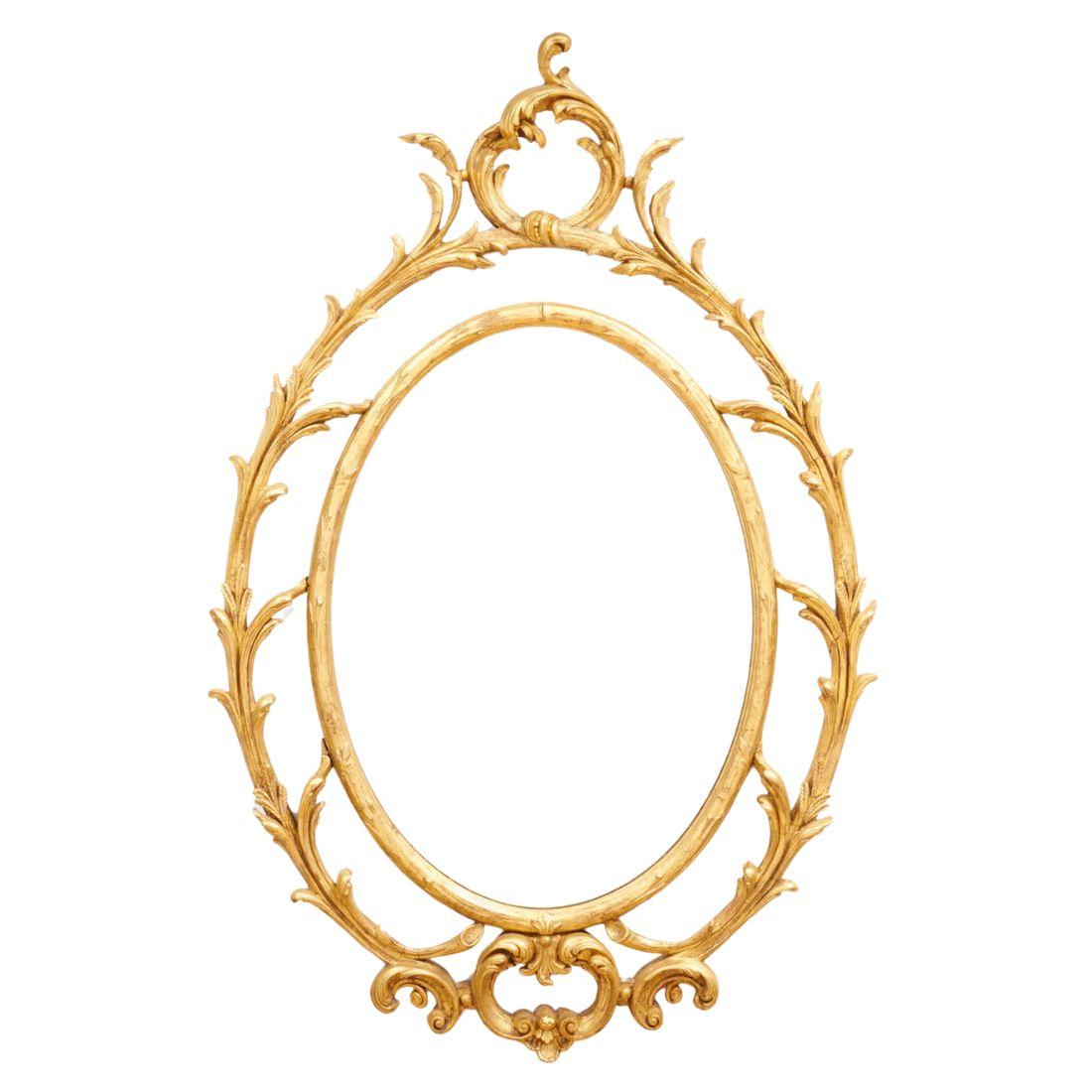 George III Pair of Oval Giltwood Mirrors With Scroll Motif For Sale