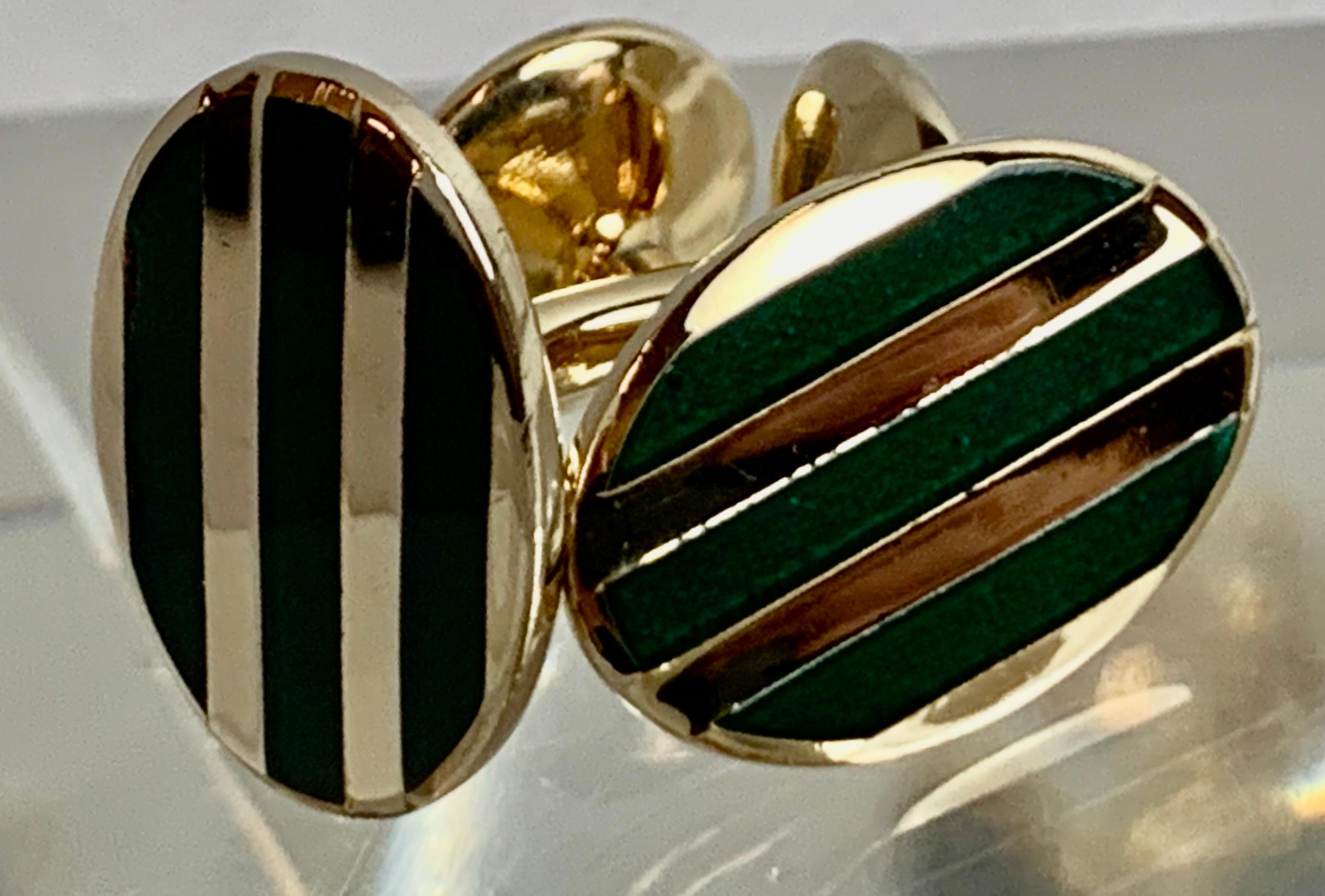 Pair of vintage gold filled cufflinks with bands of high fired green enamel.  The posts are fixed which makes them very easy to push through the openings on French cuffs.  Traditional and yet very contemporary with the simple oval shape and clean