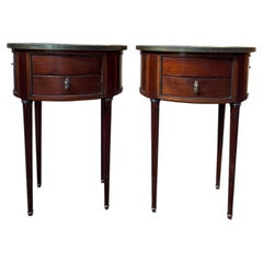 Pair of oval Louis XVI bedside tables in mahogany