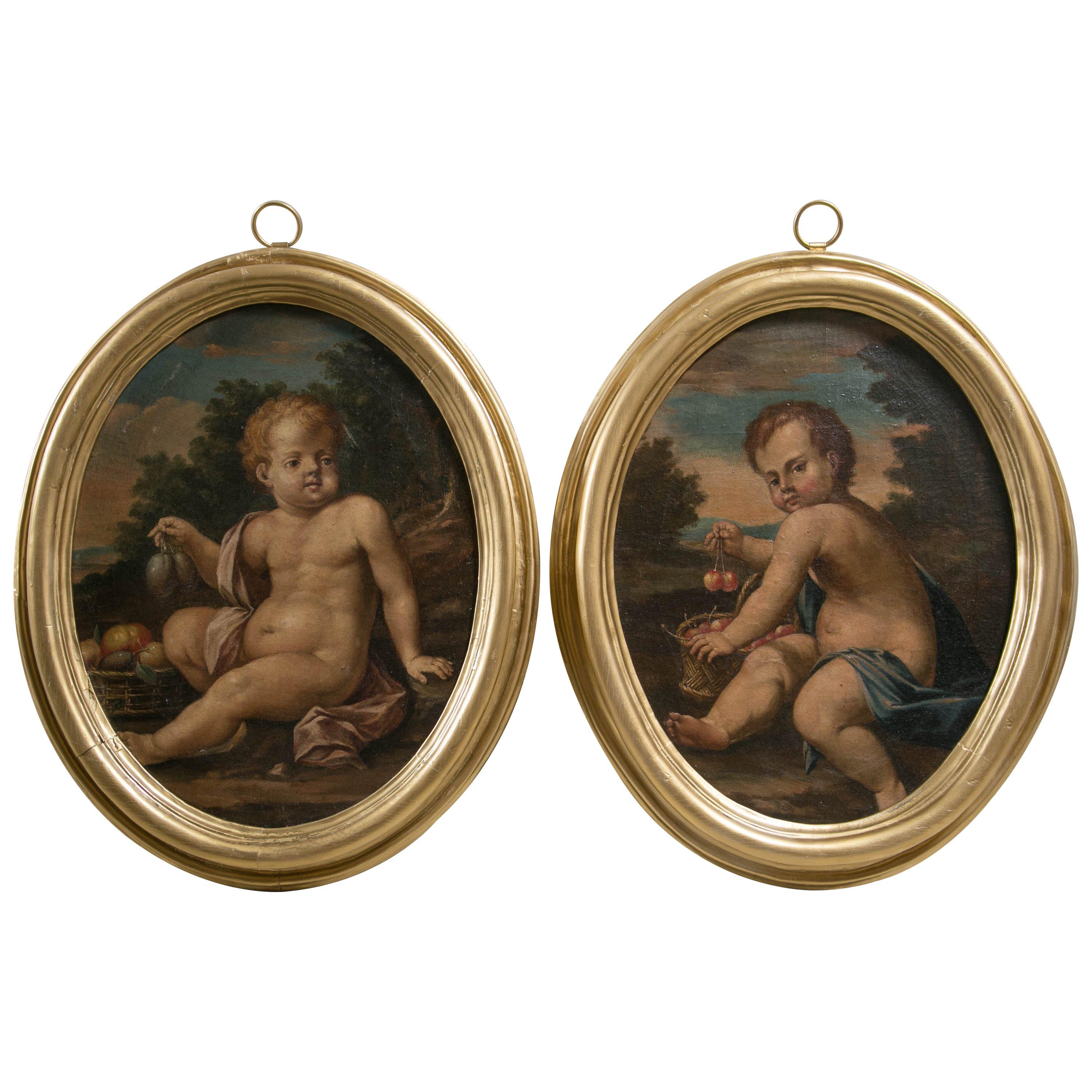 Pair of Oval Oil on Canvas Paintings of Putti For Sale