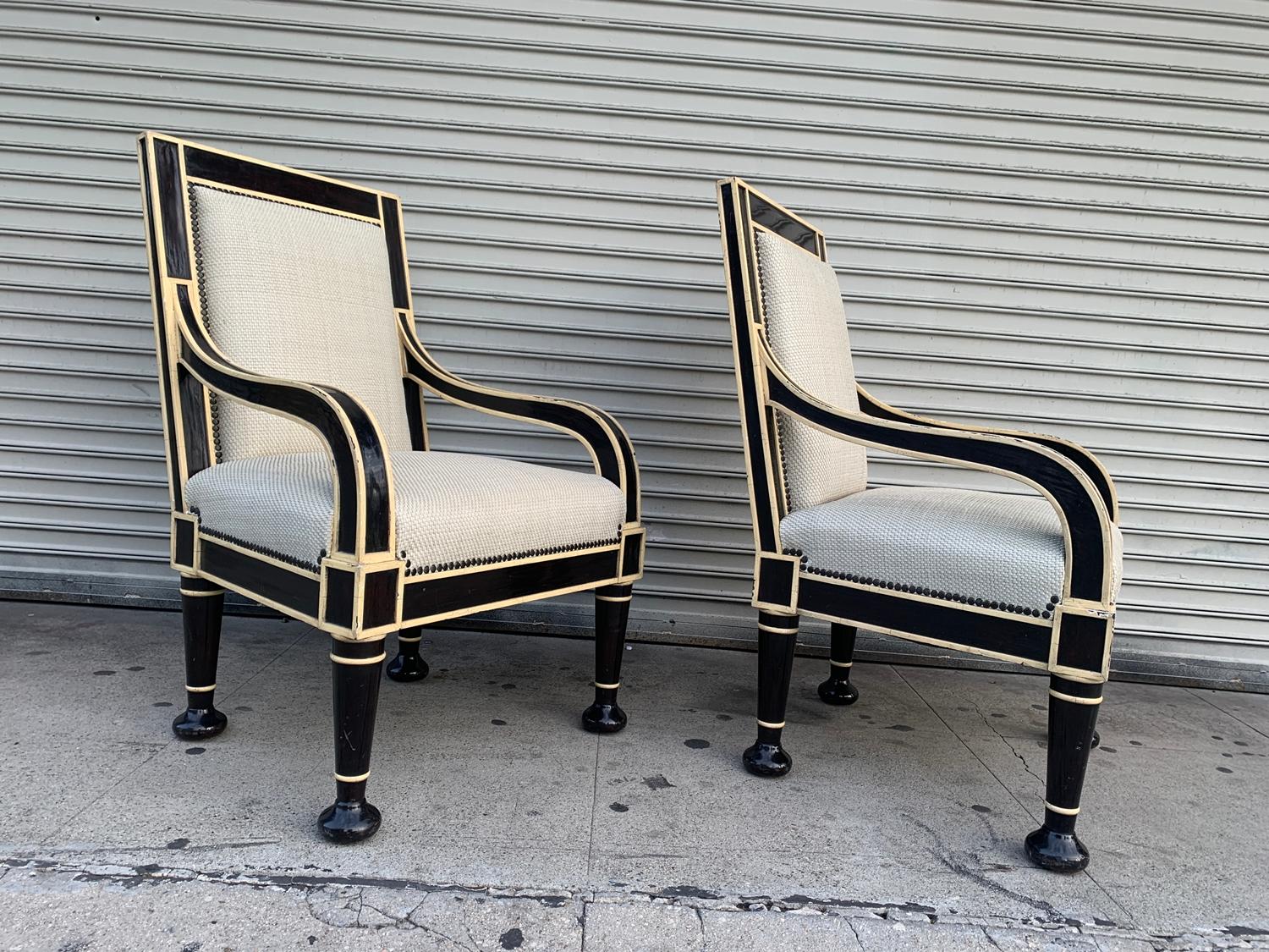 Beautiful pair of armchairs custom designed and built for a private client in Los Angeles.

The chairs are beautifully crafted and well designed, beautiful comination of colors having a crackle finish over the wood and a handwoven leather seat and