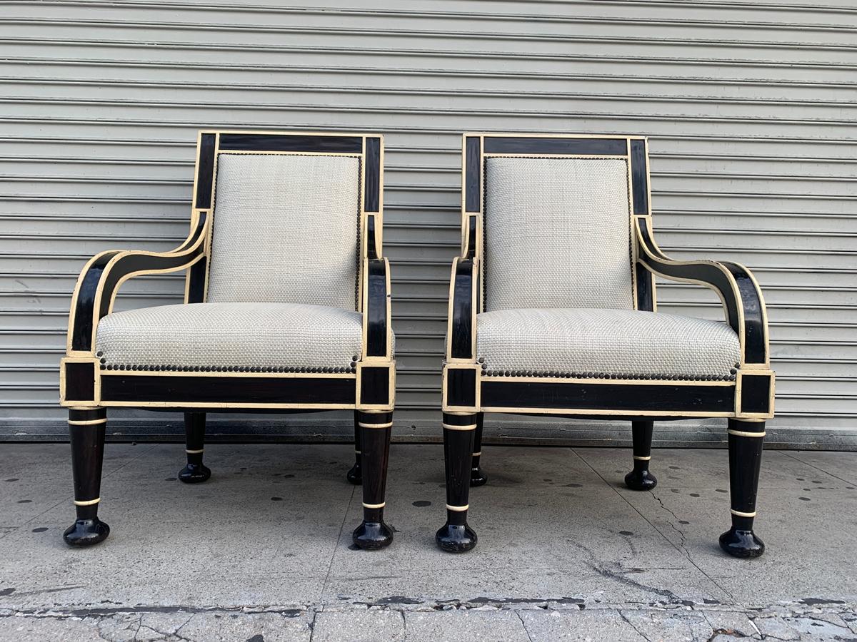 Beautiful pair of armchairs custom designed and built for a private client in Los Angeles.

The chairs are beautifully crafted and well designed, beautiful combination of colors having a crackle finish over the wood and a hand woven leather seat