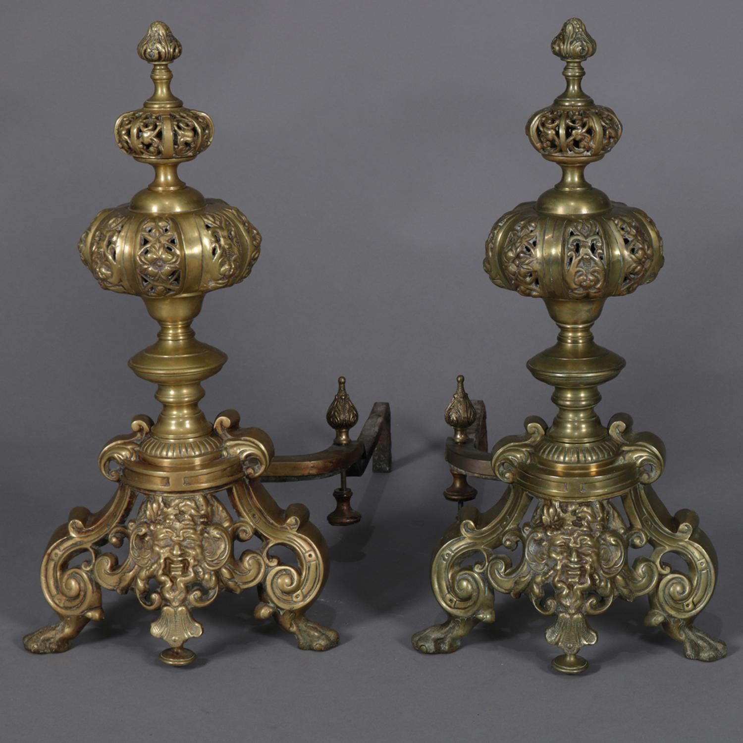 Pair of oversized Baroque style brass chenets feature graduated and pierced graduated bowls and finial over scroll and foliate base having central mask, circa 1890.

***DELIVERY NOTICE – Due to COVID-19 we are employing NO-CONTACT PRACTICES in the