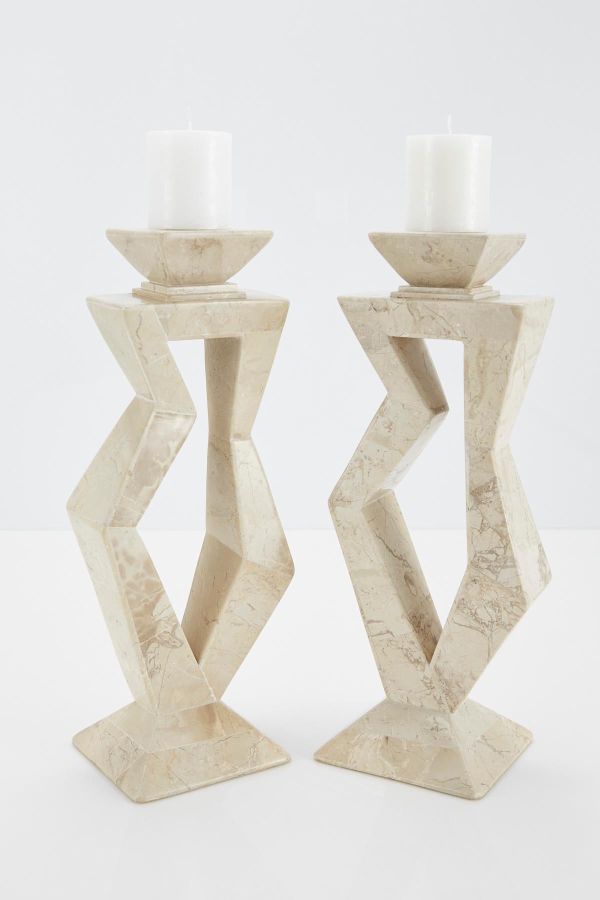 Pair of large candlesticks with jaunty abstract shape, executed in tessellated cantor stone over wood. Postmodern styling.