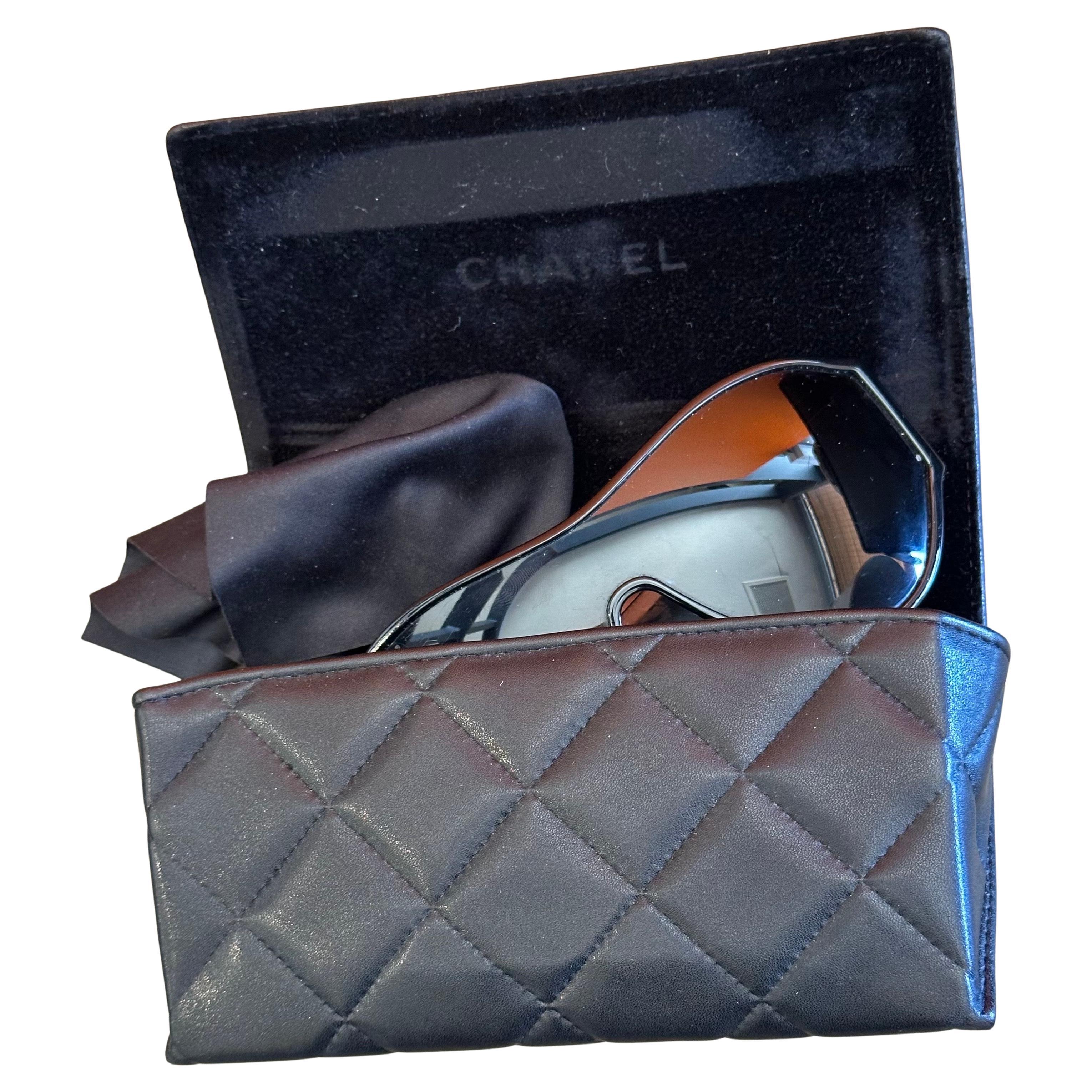 A very nice pair of oversized quilted shield sunglasses, model #5426, with original case and box by Chanel, circa 2010s.  The glasses are in very good vintage condition.  #4557