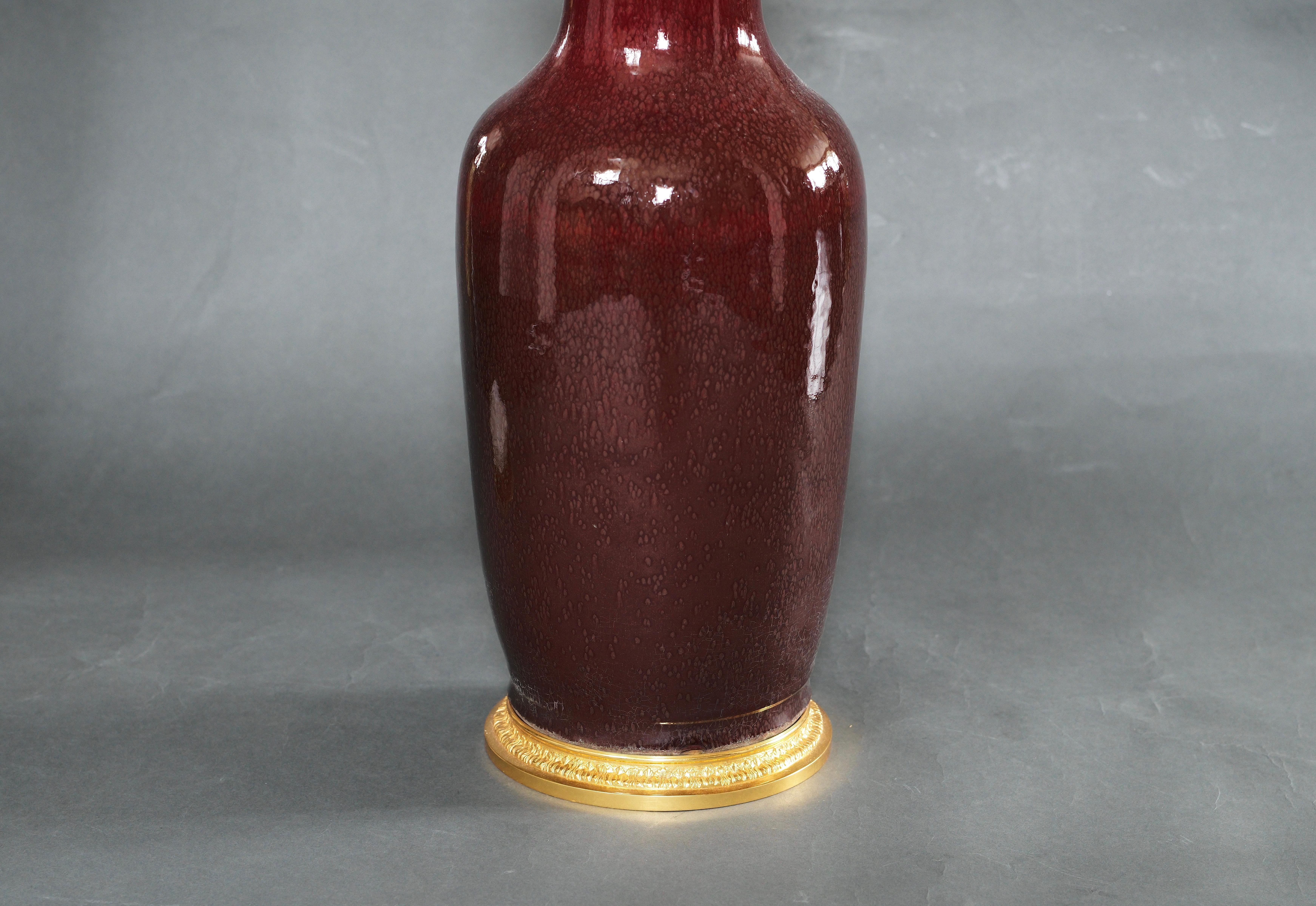 Pair of oxblood porcelain vase with fine cast gilt brass bases mount as lamps.
To the top of the porcelain is 22