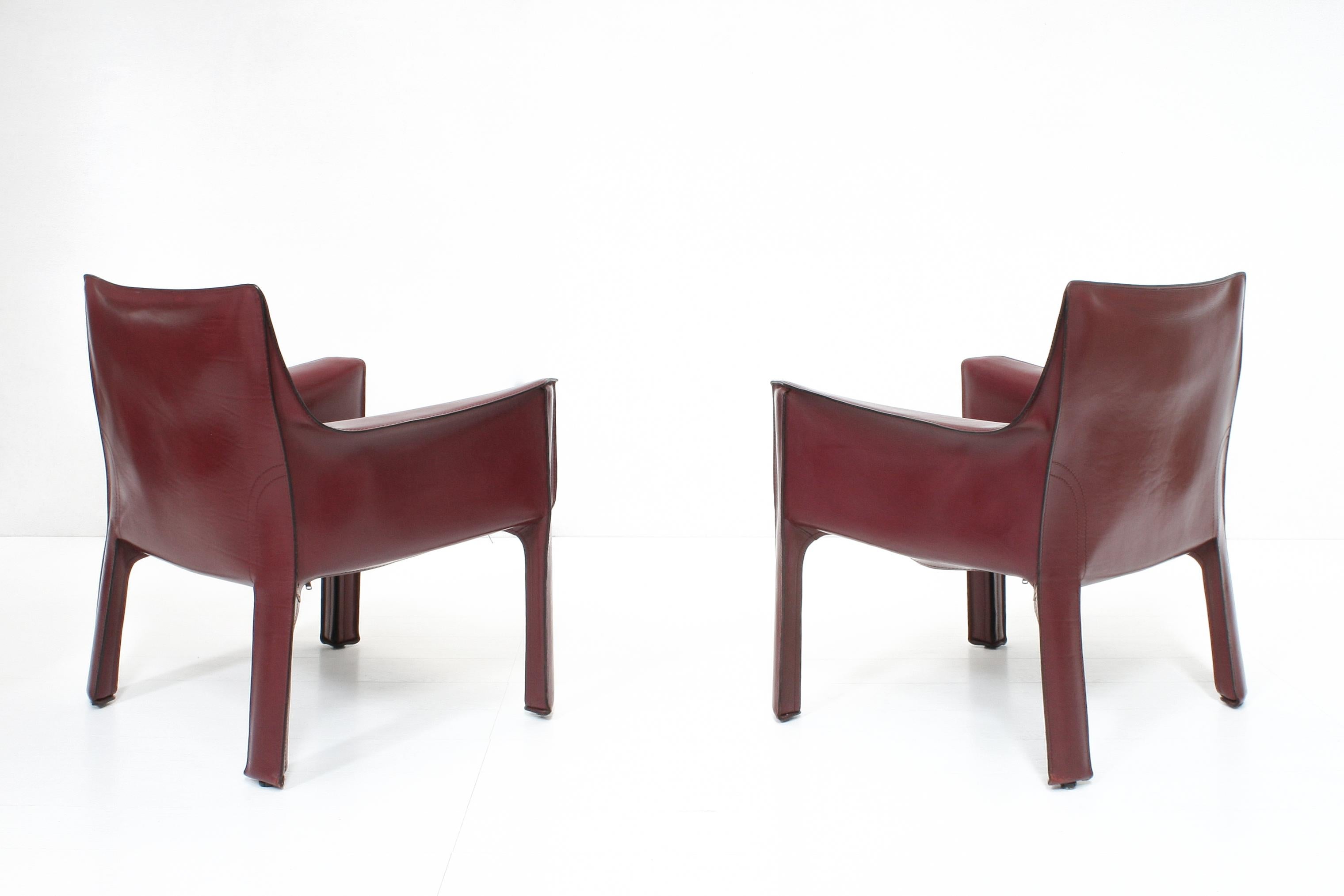 These more rare, lower lounge versions of the well known CAB chair is executed in striking oxblood red leather and designed by Mario Belline for Cassina.