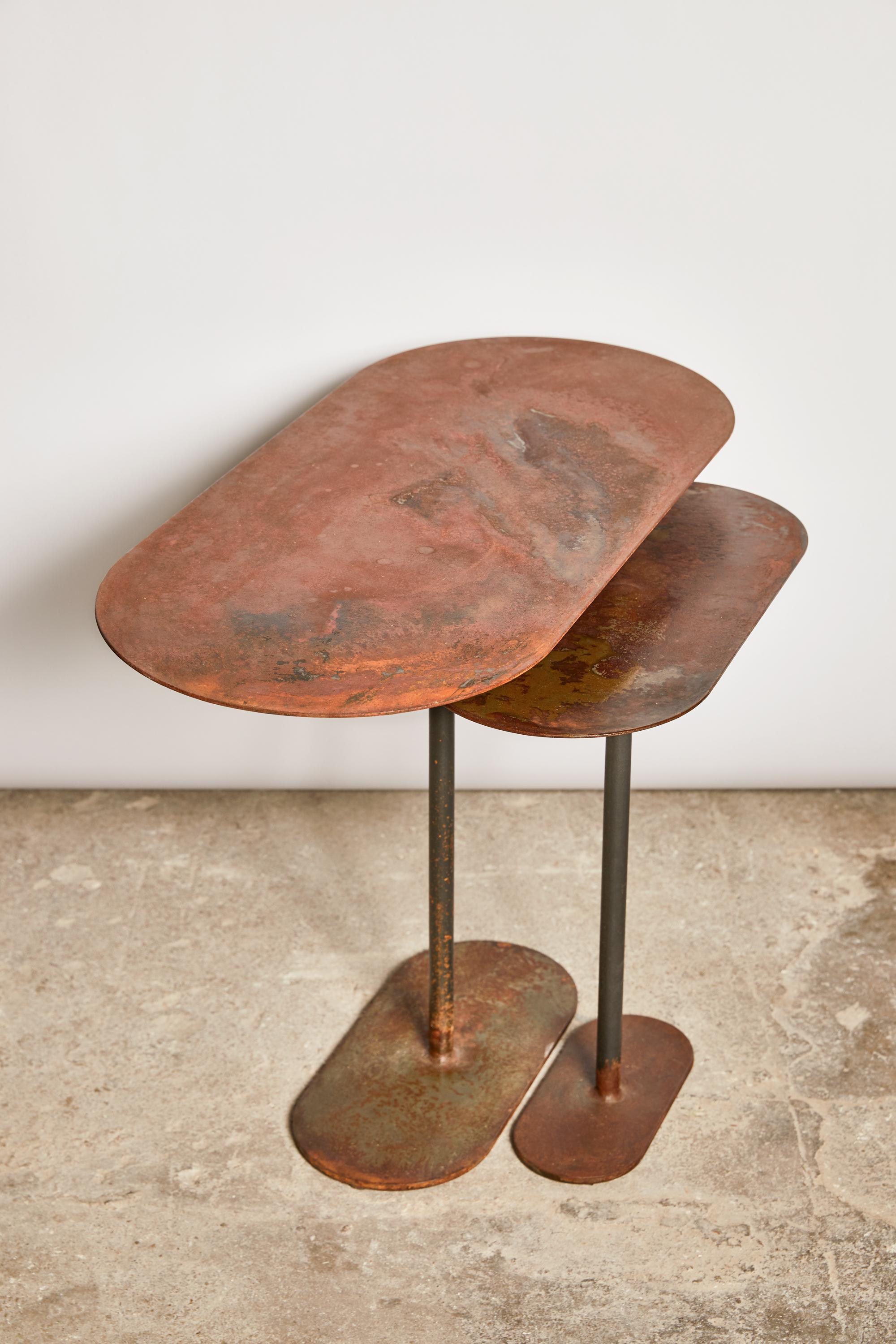 Pair of oxidized ellipses table signed by Pia Chevalier
Oxidized steel.
Dimensions:
Large 60 x 27 cm H. 45 cm
Small 40 x 18 cm H. 40 cm

Pia Chevalier is a French contemporary designer.
Independent Designer, trained in Design and Crafts and