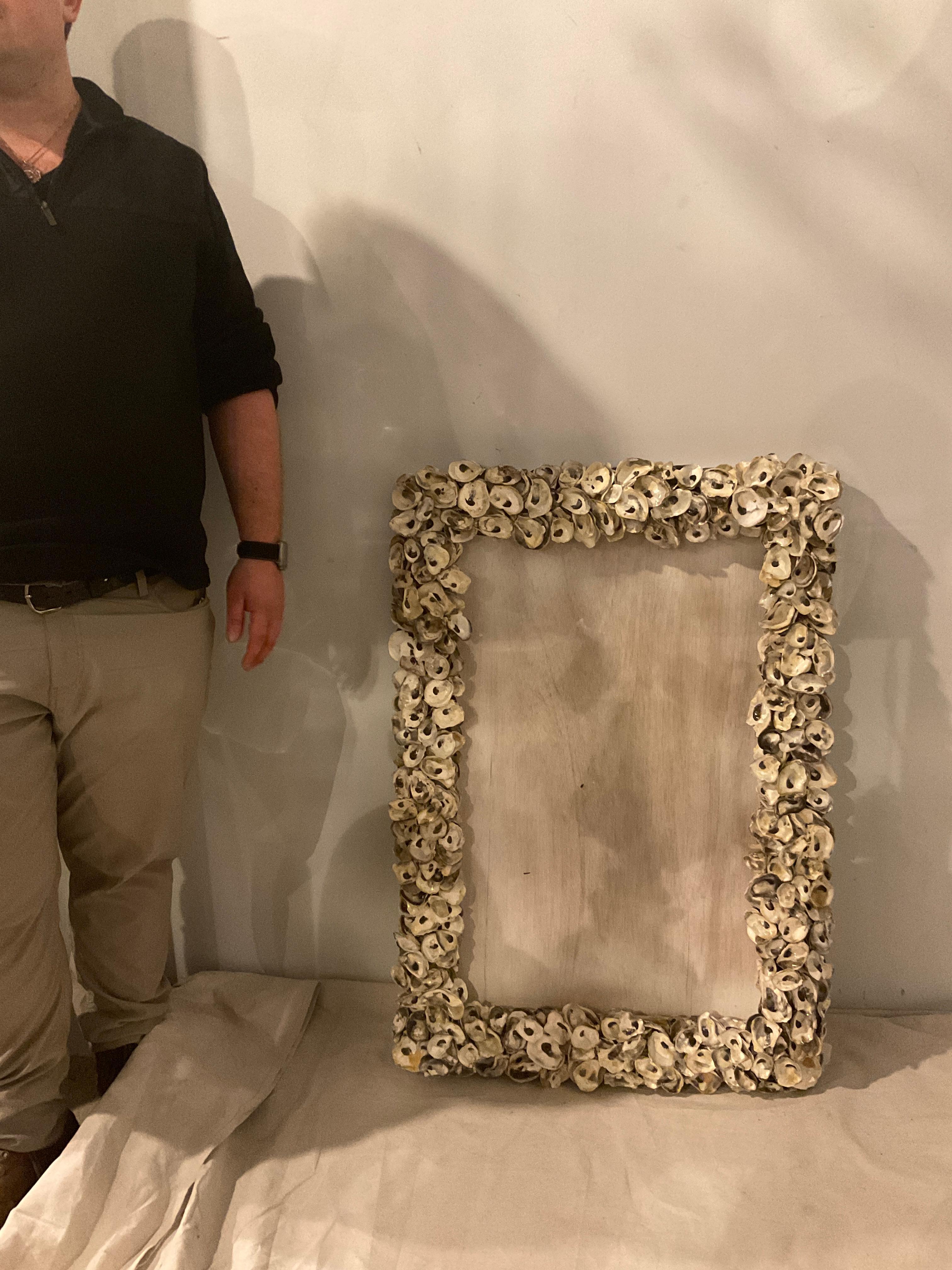 Oyster shell frame for a mirror. Handmade. There are 2 available. These frames do not include mirror. You must purchase mirror separately when you receive the frame.
Frame is new, one is still in the box. Price is 1200.00 per frame.