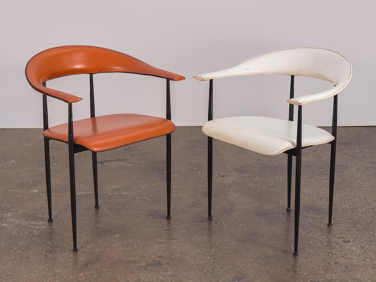 Fetching 1980s Italian Model P40 armchairs by Giancarlo Vegni and Gianfranco Gualtierotti for Fasem. The single back piece curves forward to form the armrests for this sculpted elegant chair. Ponti-style black metal frames contrast the