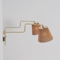 Pair of Paavo Tynell Adjustable Rattan Shade Wall Lights Model 9414, Taito 1950s