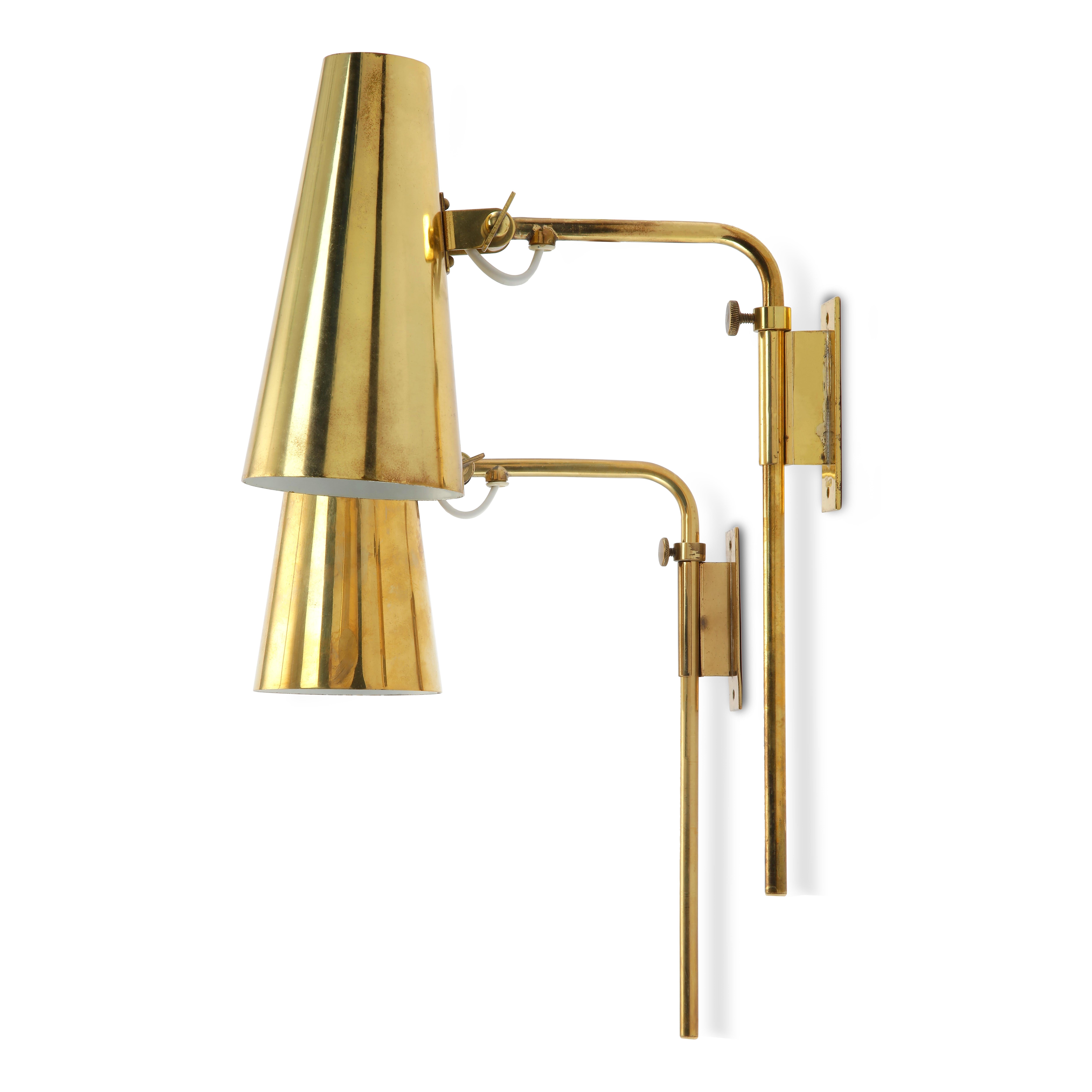 Paavo Tynell & Taito Oy - Scandinavian Modern

A beautiful pair of Paavo Tynell brass brass wall lights, Finland, 1950s. 

Model 9459 wall lights for Taito Oy. Marked on the top of the shades. 

These wall lights are rare and beautifully