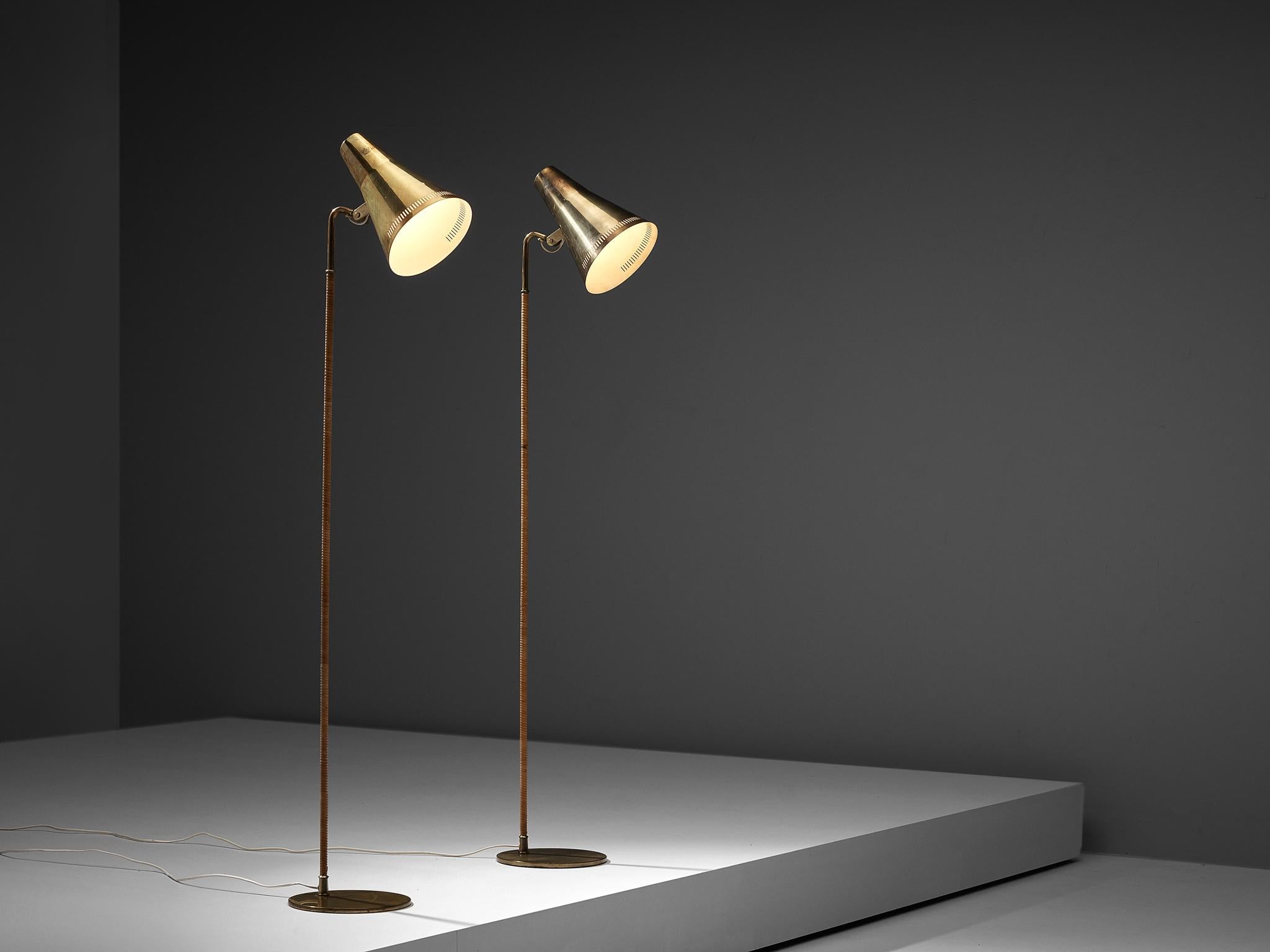 Paavo Tynell for Taito, pair of floor lamps K-10, lacquered metal, brass, cane, Finland, 1950s

Outstanding pair of floor lamps, designed by Paavo Tynell, the Finnish design master of lighting. These delicate floor lamps have a few distinct
