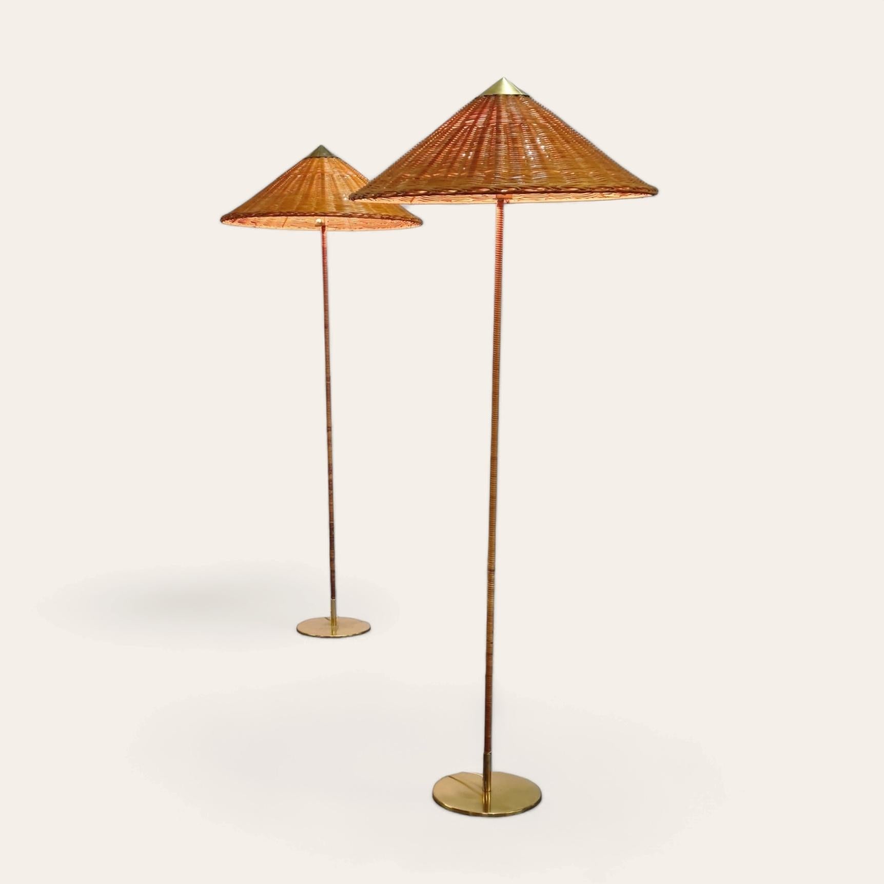 A beautiful pair of the highly sought after Paavo Tynell floor lamps model 9602 aka Chinese hat for Idman.

This iconic floor lamp was originally designed by Paavo Tynell in the late 1930s and has been refined during the golden era of the Tynell